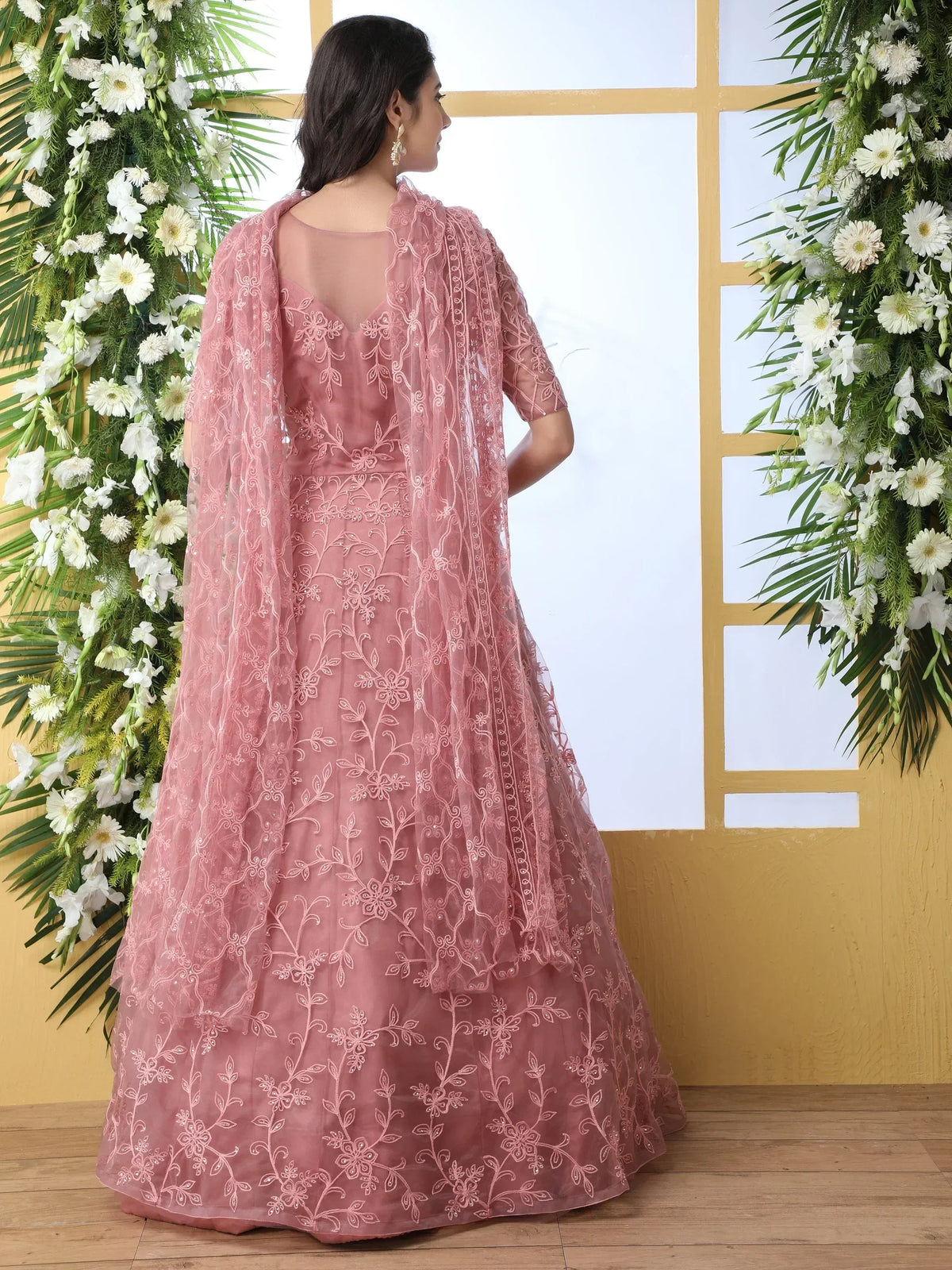 Pink embroidered lehenga choli with floral net dupatta, perfect for Indian ethnic occasions