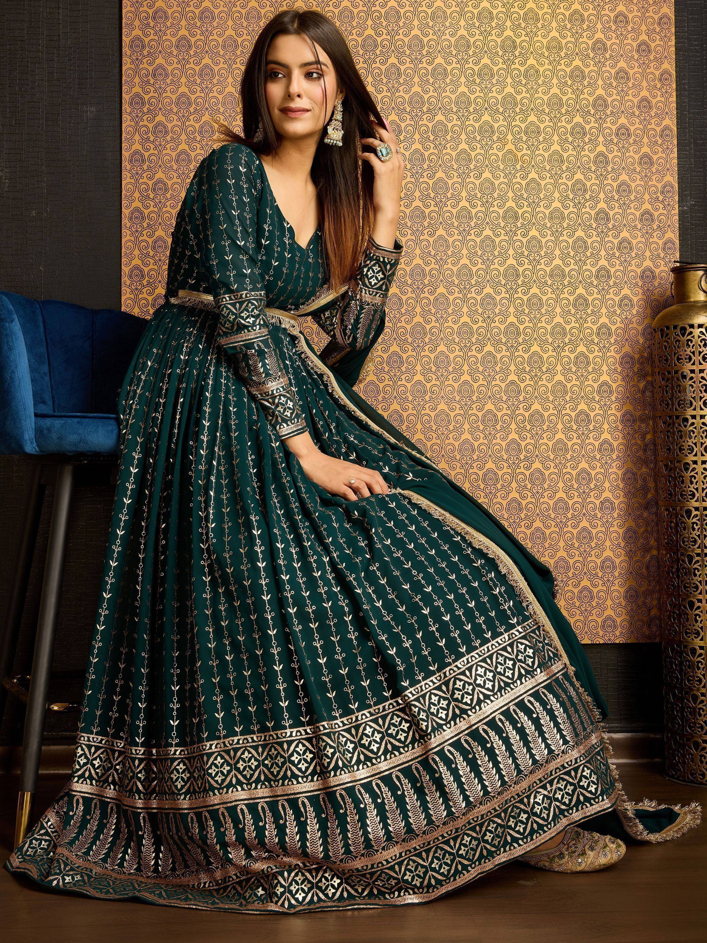Emerald green designer anarkali with gold embroidery, perfect for Indian ethnic wear and festive occasions.