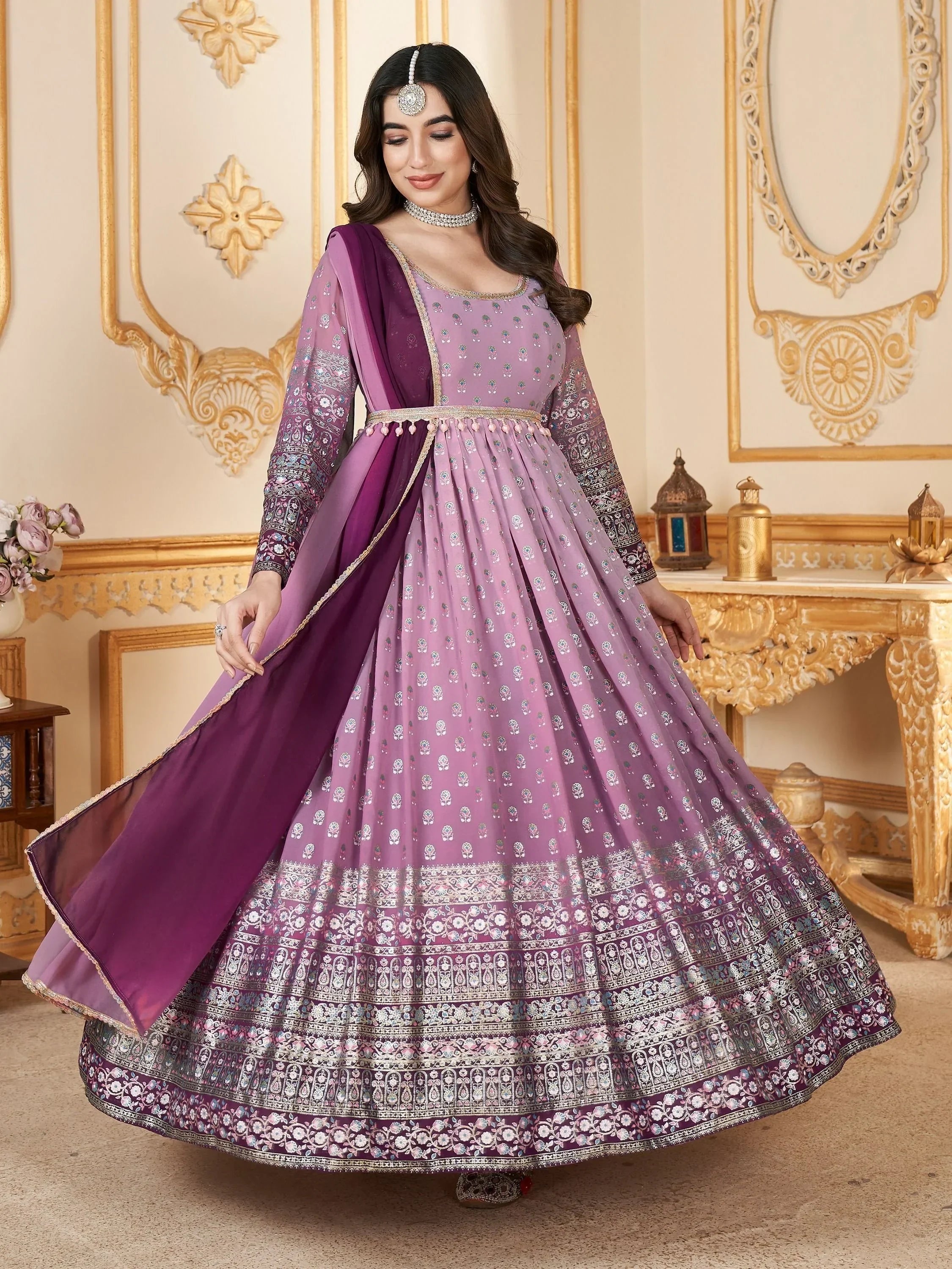 Woman in a lavender embroidered Anarkali suit with dupatta, traditional Indian ethnic wear