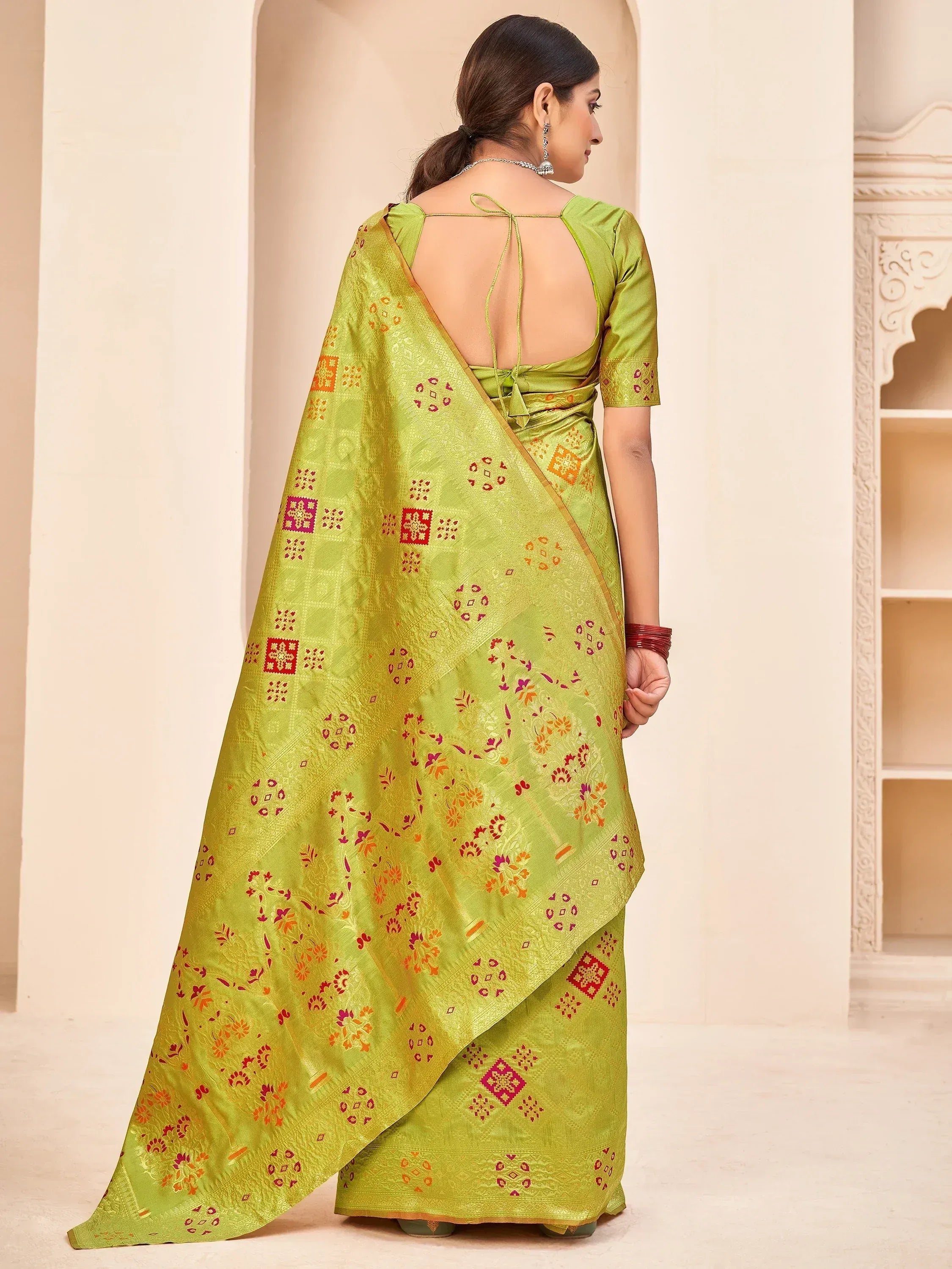 Green ethnic saree with floral and geometric prints, backless blouse, Indian designer wear