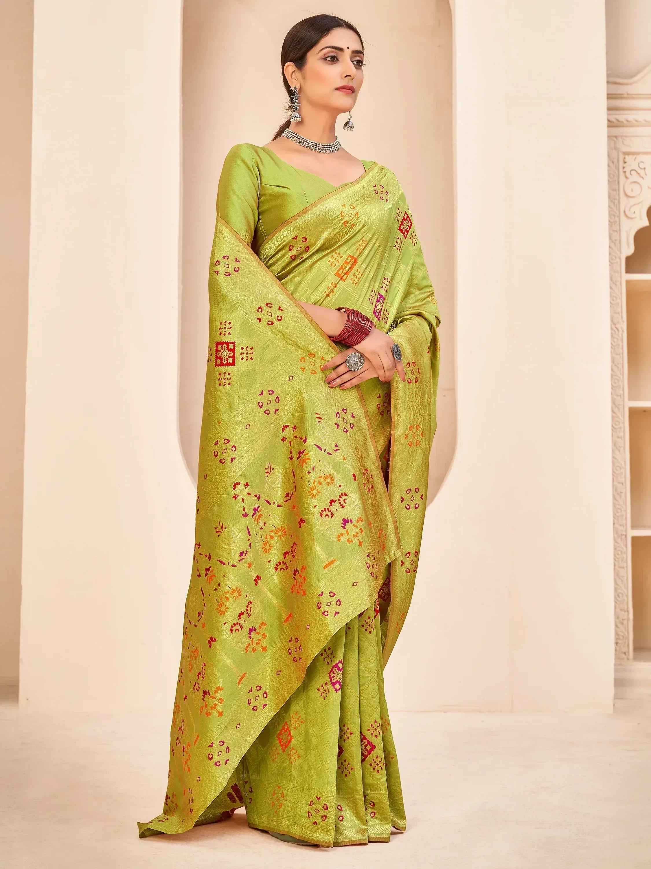 Lime green designer saree with floral and geometric prints, perfect for ethnic occasions