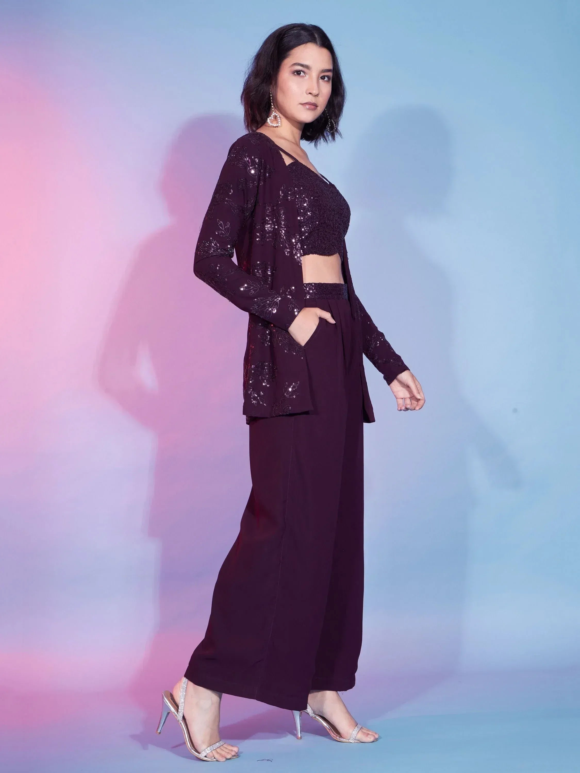 Elegant purple ethnic palazzo set with sequin embroidery, perfect for festive occasions and parties.