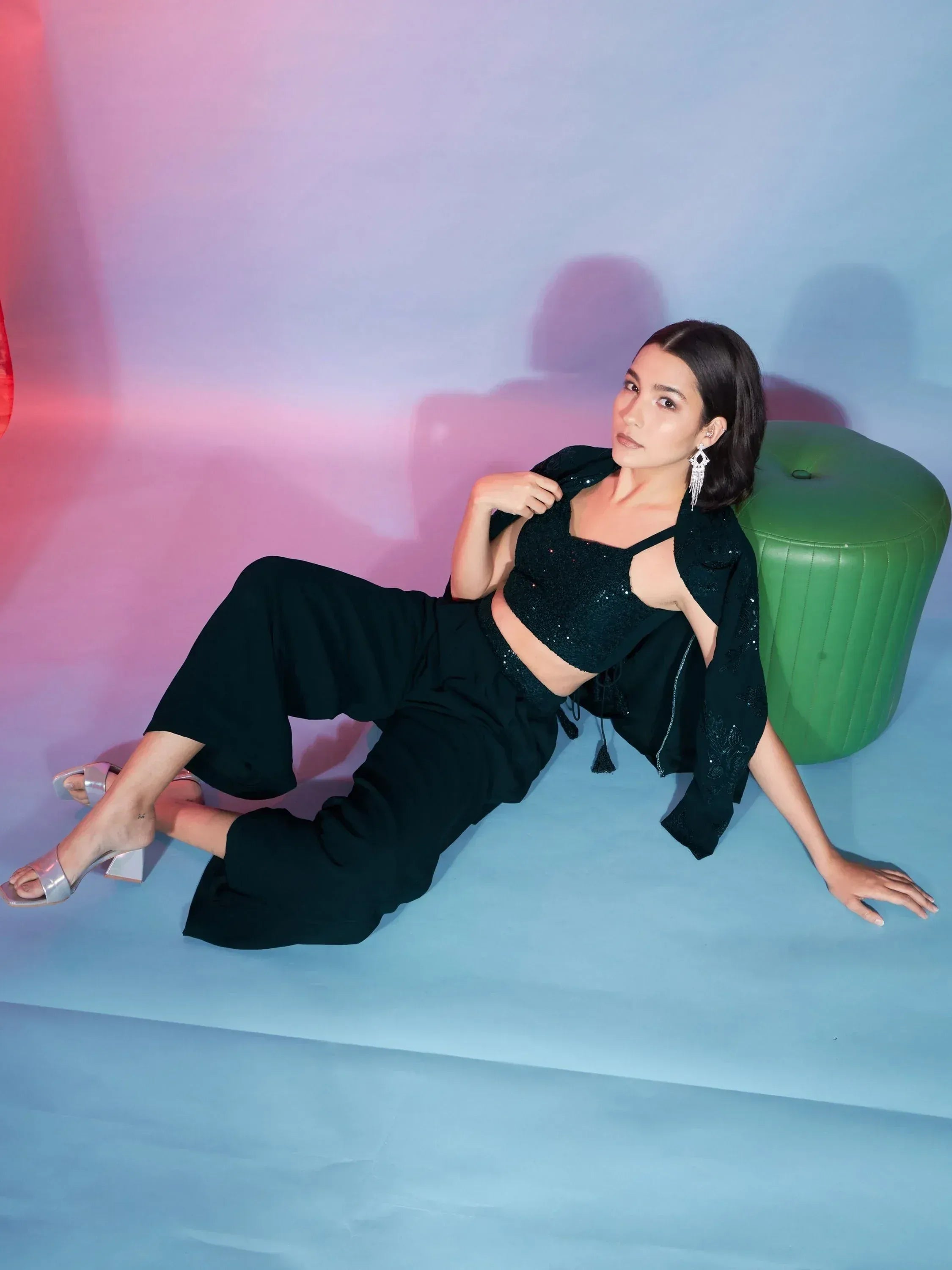 Woman in black sequin crop top and palazzo pants, stylish ethnic wear for modern occasions