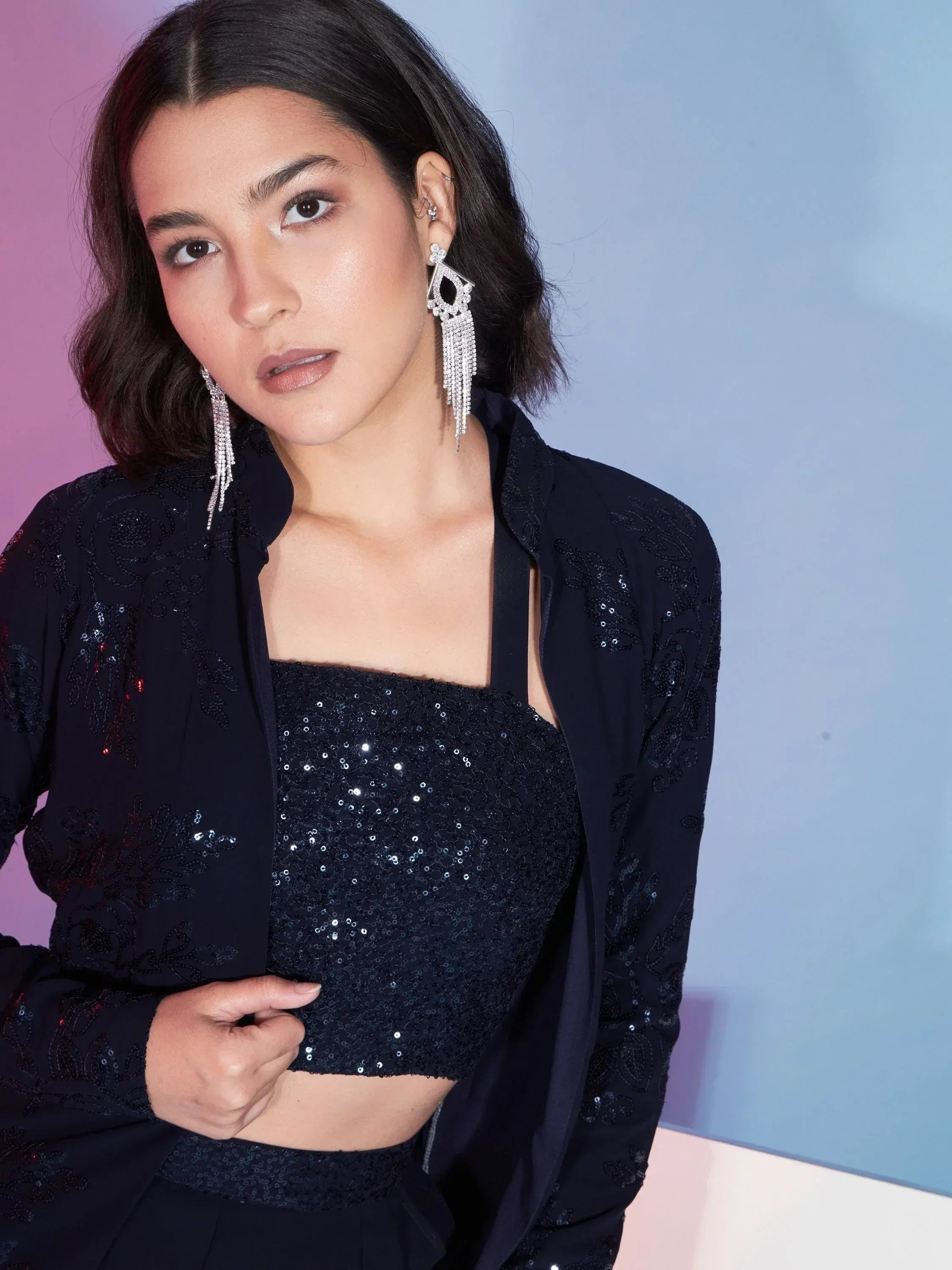Black sequin ethnic crop top with embroidered jacket and statement earrings