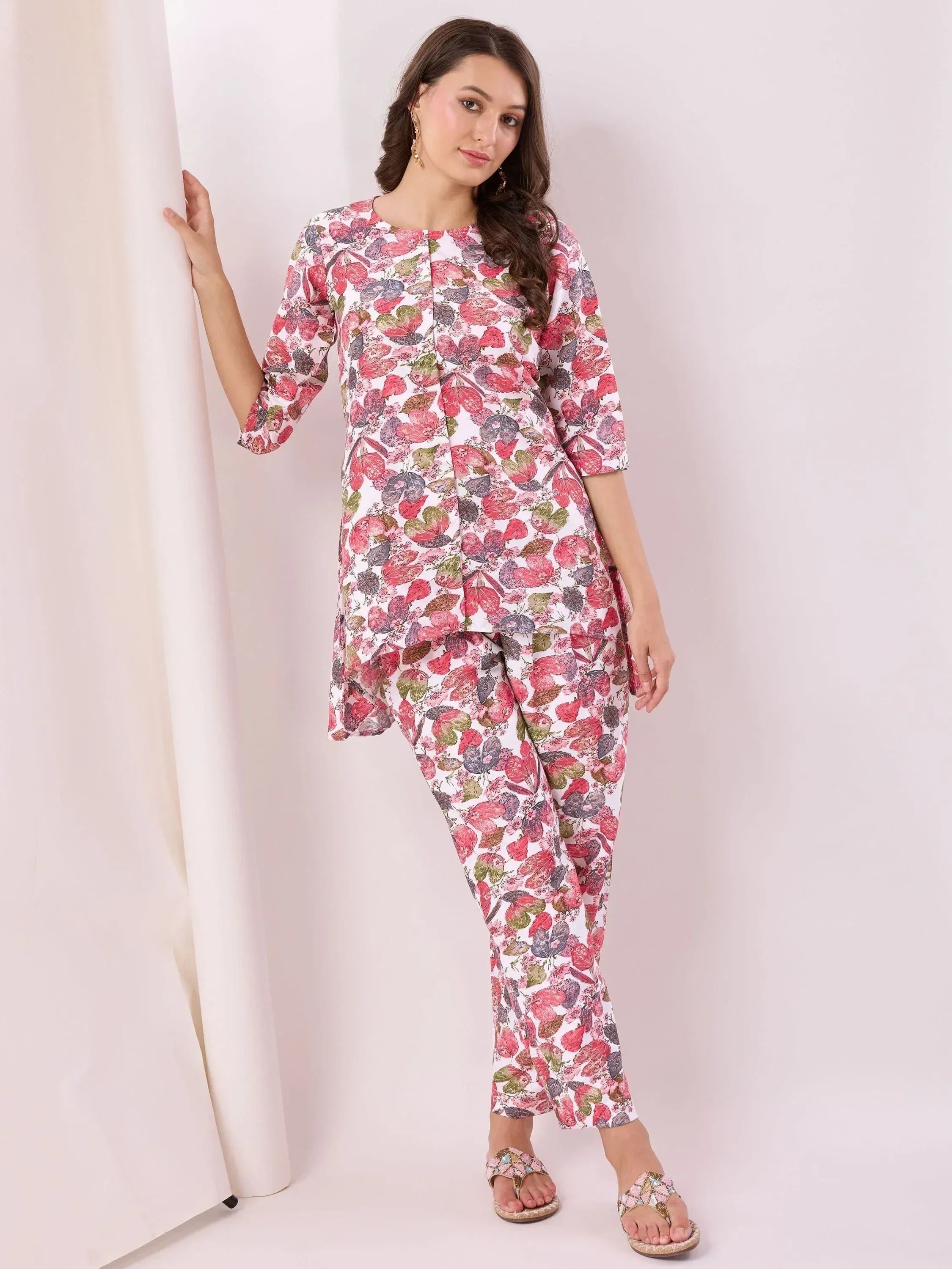 Floral print salwar kameez set with pink, green, and purple blooms, perfect for ethnic wear