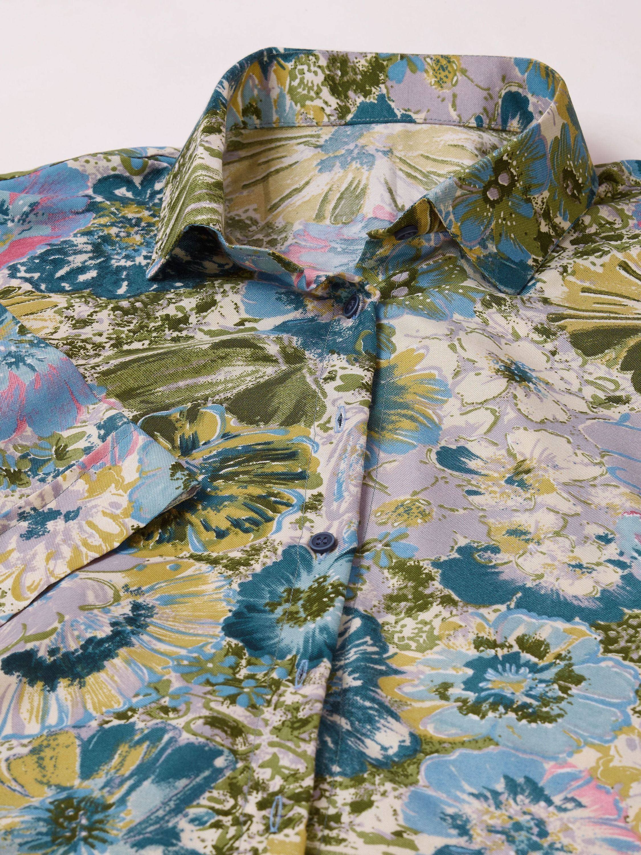 Vibrant floral print ethnic shirt with blue, green, and yellow hues, featuring a classic collar and button-down front.