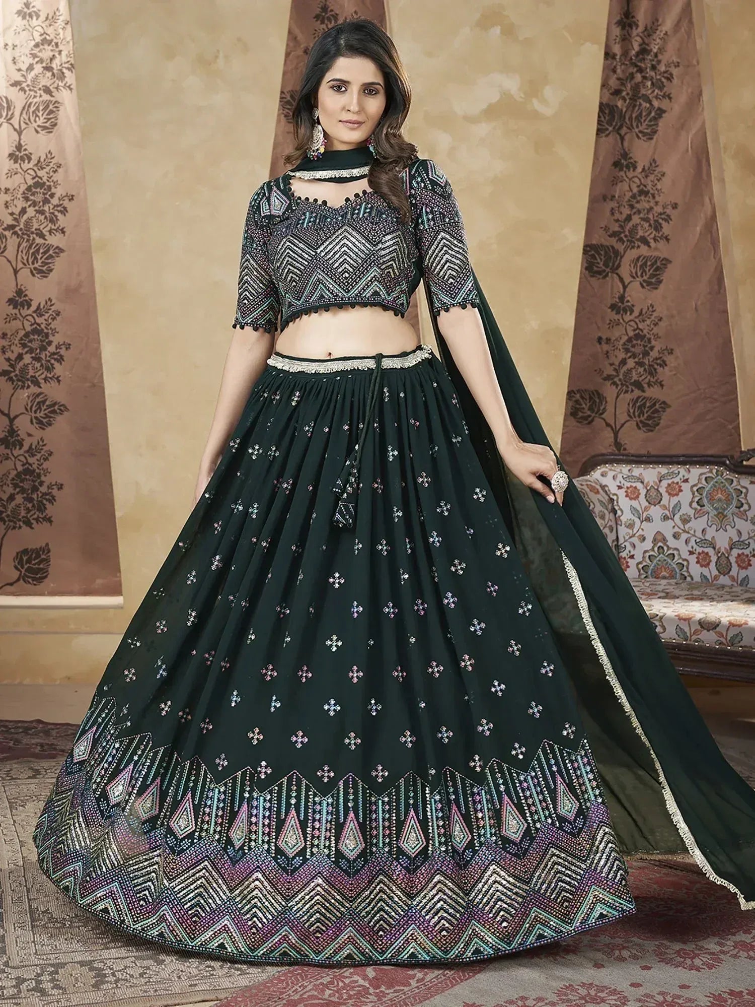Emerald green embroidered lehenga choli with geometric patterns, perfect for Indian ethnic wear and festive occasions.