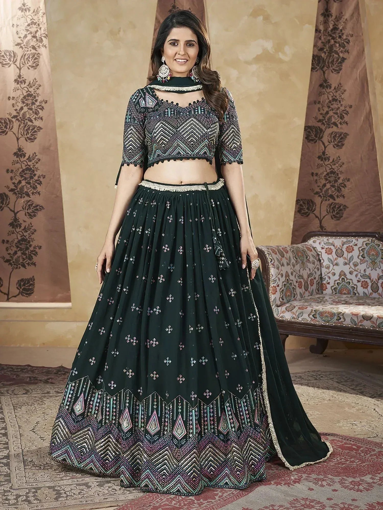 Dark green embroidered lehenga choli with geometric patterns, perfect for Indian ethnic wear occasions.