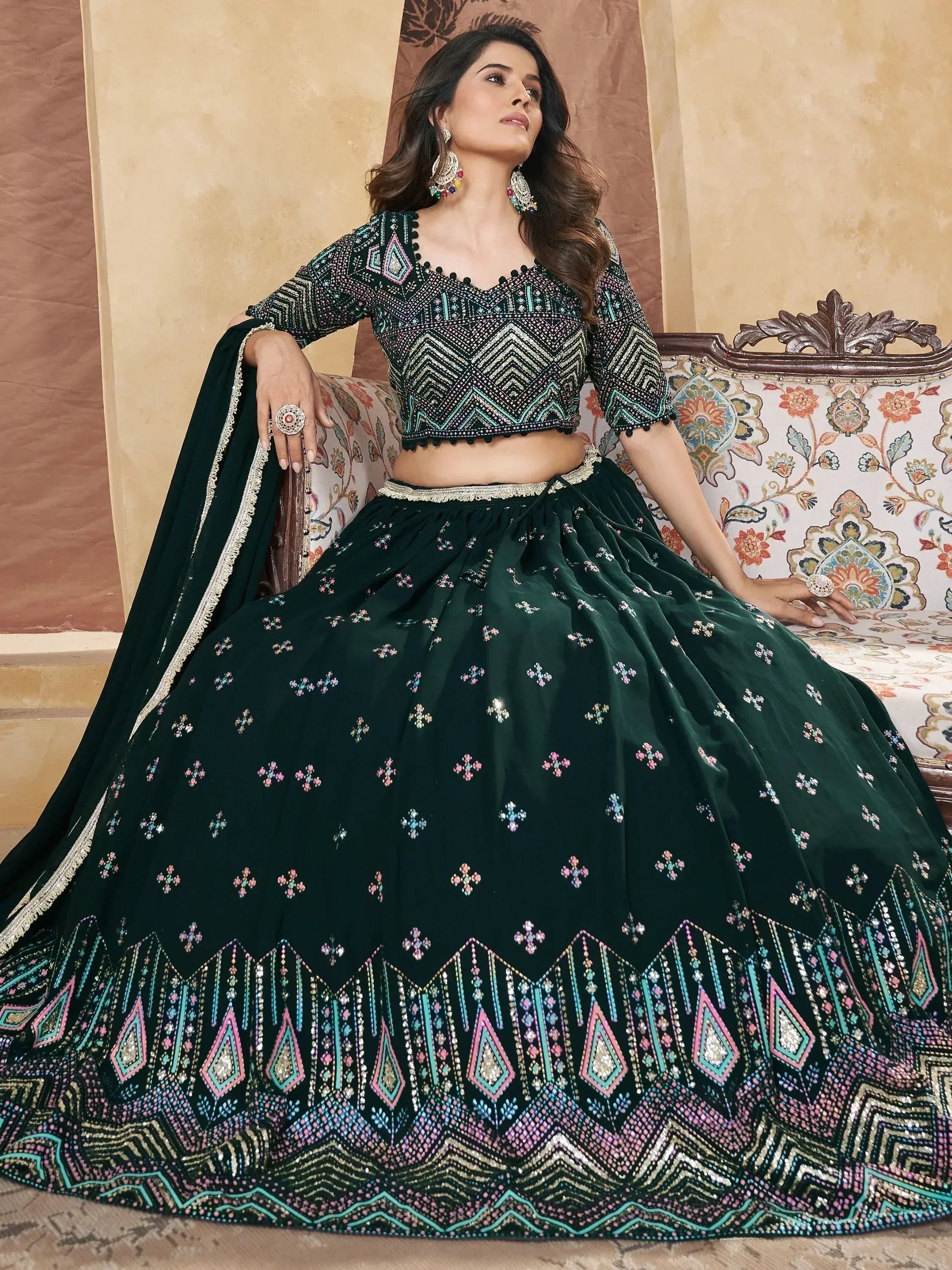 Emerald green embroidered lehenga choli with geometric patterns, perfect for Indian ethnic wear events.