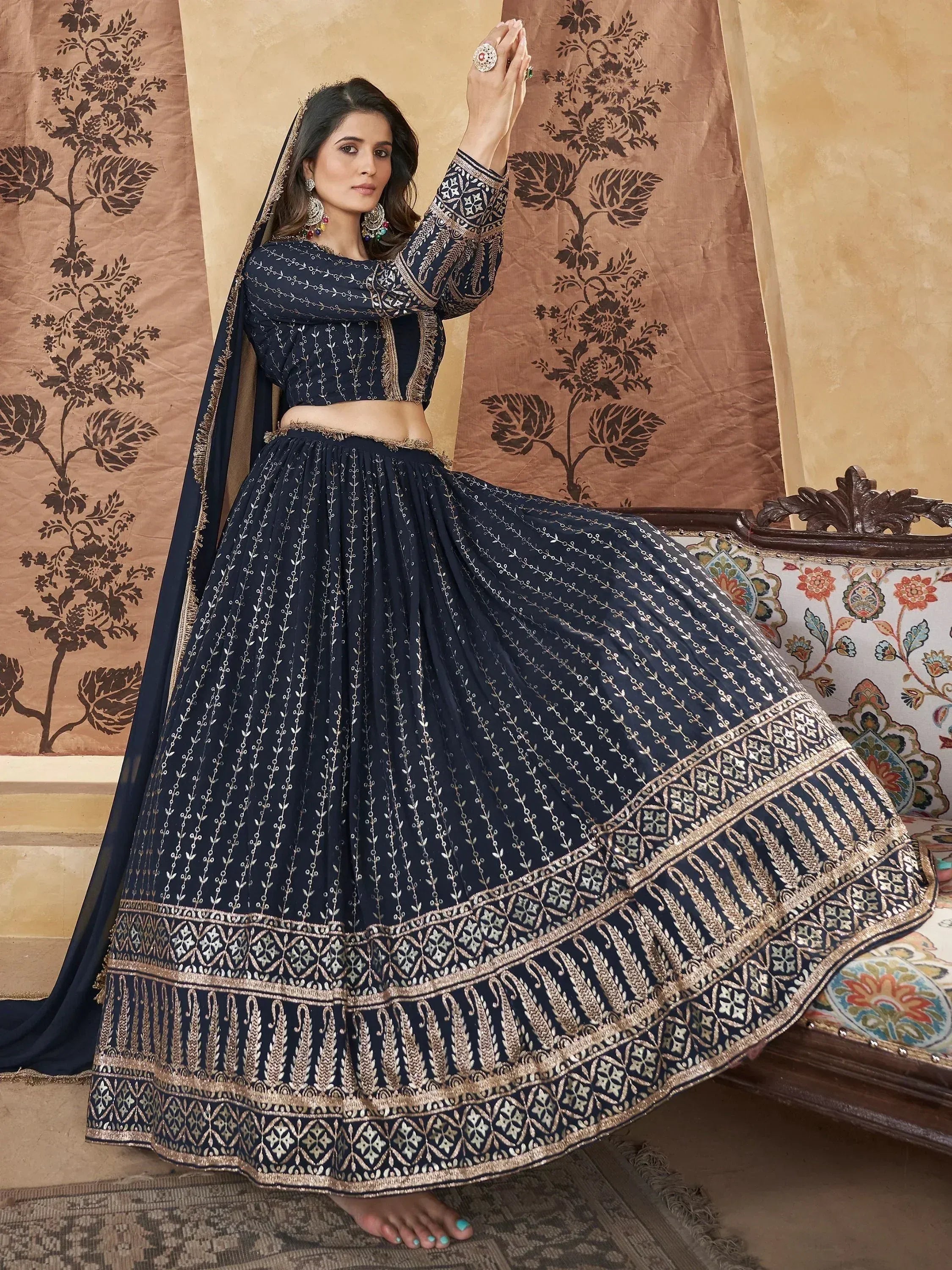 Navy blue designer lehenga choli with gold embroidery, perfect for Indian ethnic wear occasions.