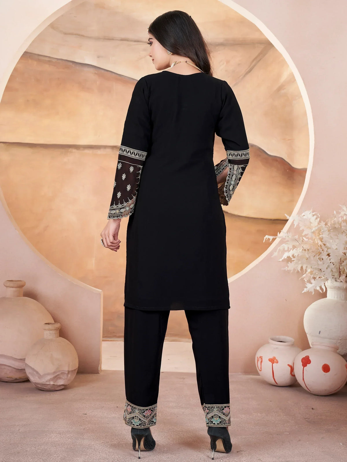 Black ethnic kurti with embroidered sleeves and pants, stylish Indian wear for women