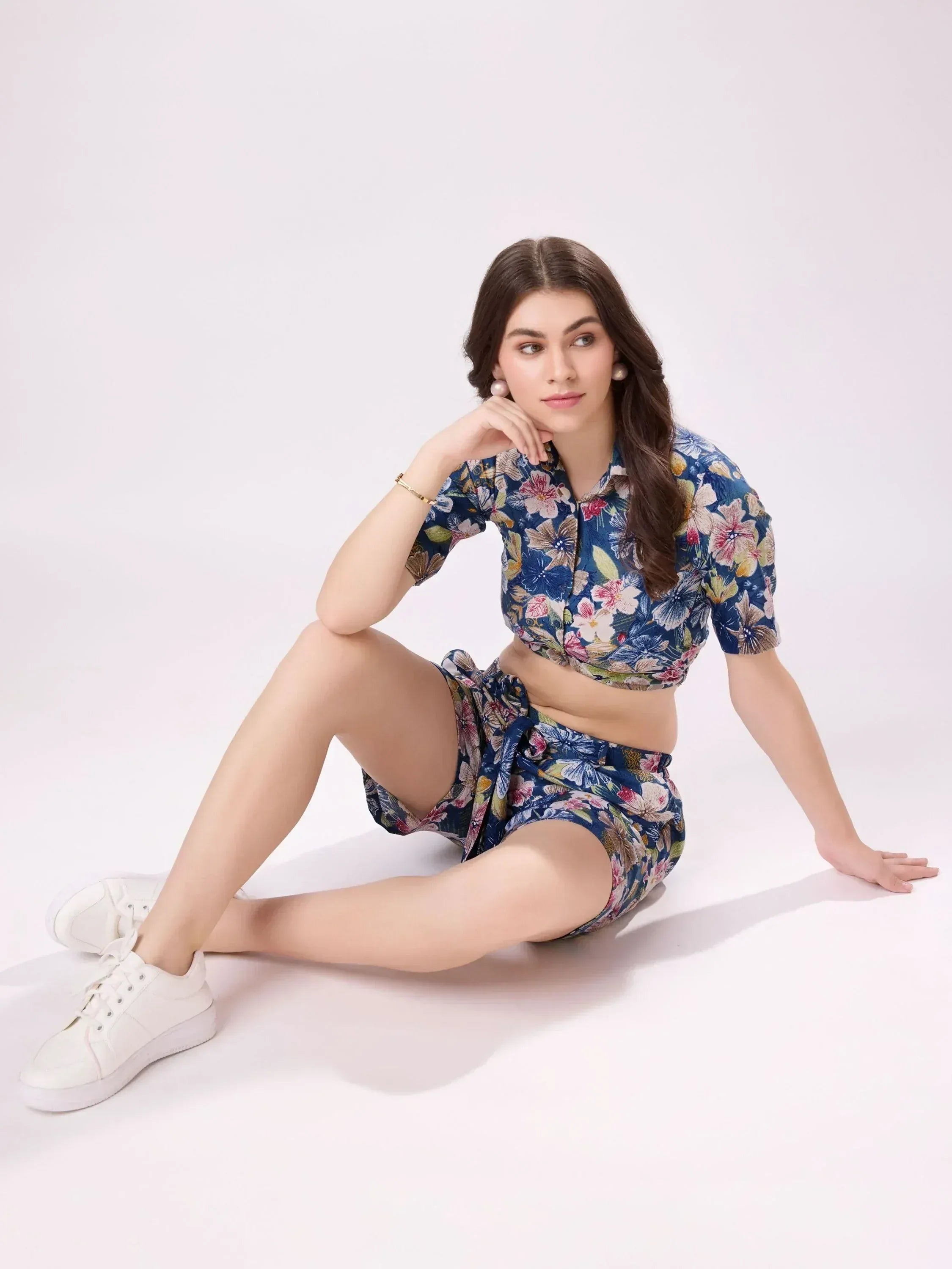 Floral print ethnic crop top and shorts set with white sneakers, perfect for casual Indian wear