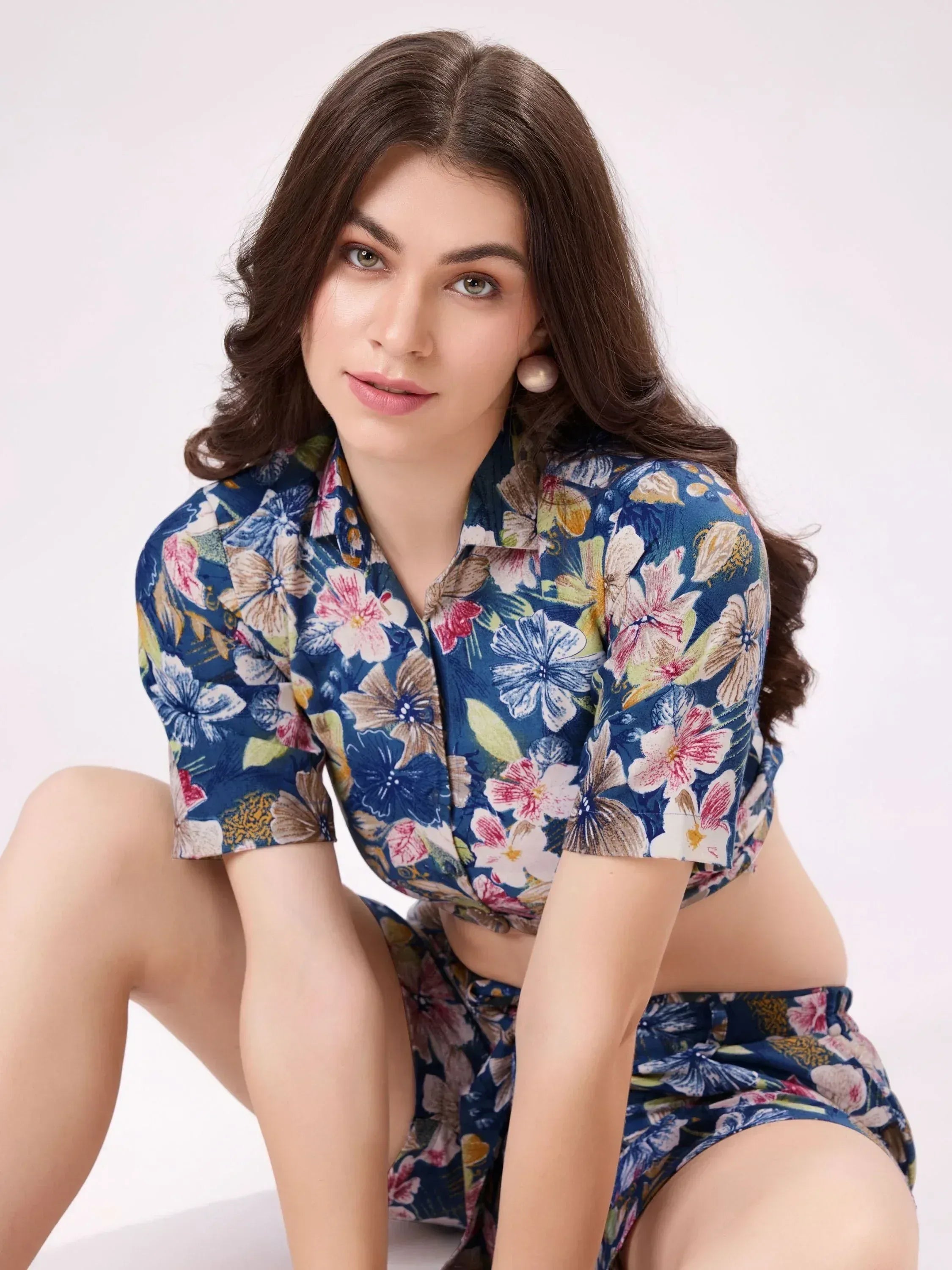 Woman in blue floral print ethnic crop top and matching shorts, stylish Indian wear