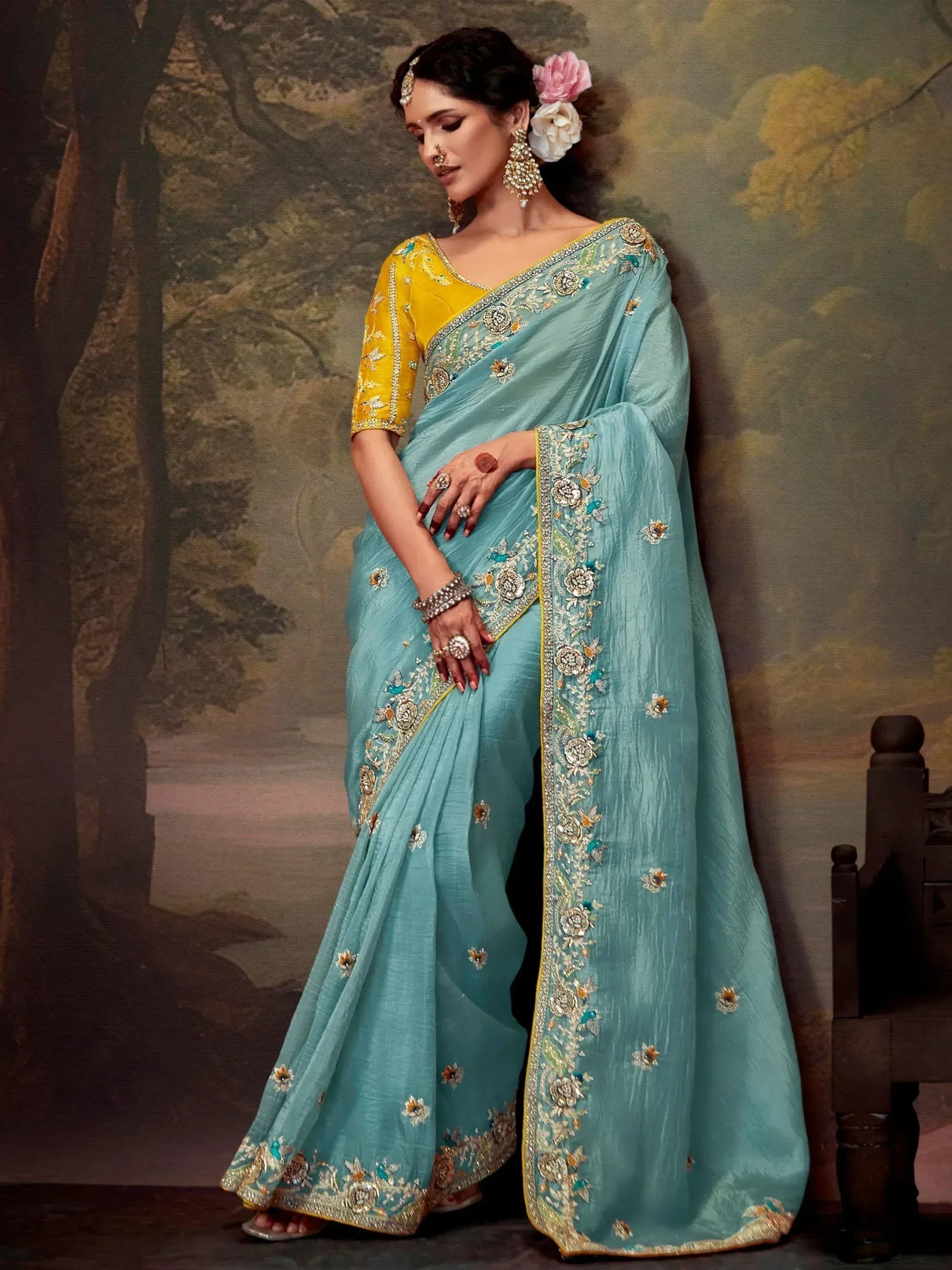 Elegant turquoise saree with gold embroidery and yellow blouse, perfect for Indian ethnic wear occasions.