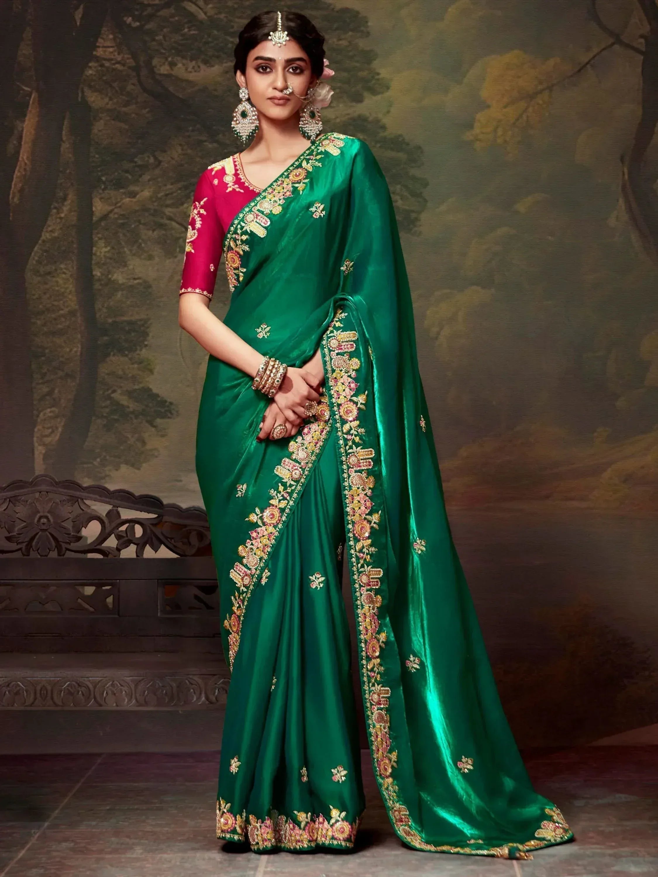 Emerald green embroidered saree with pink blouse, perfect for Indian ethnic wear and festive occasions.