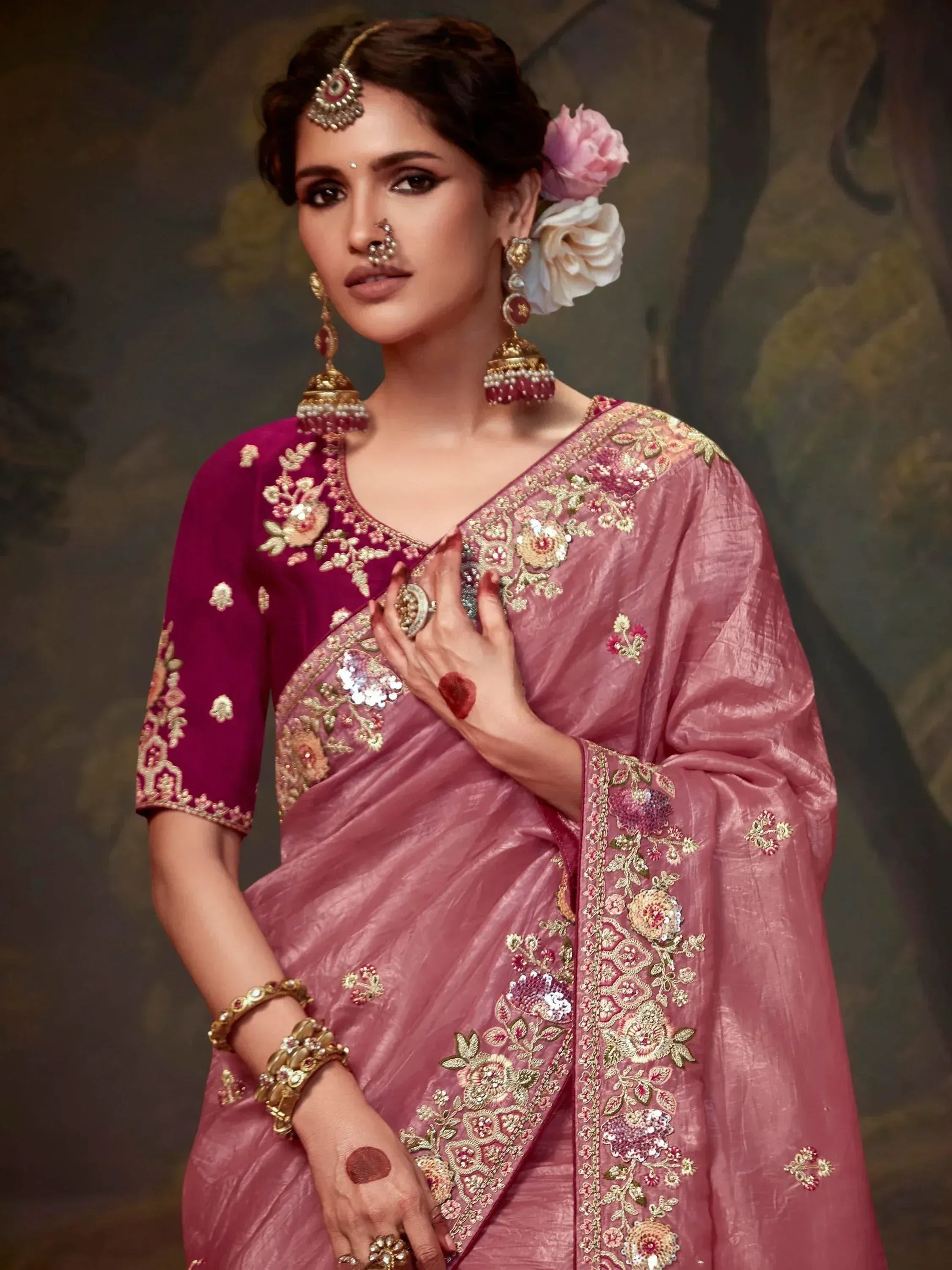 Elegant pink embroidered saree with floral gold detailing, traditional Indian ethnic wear for weddings