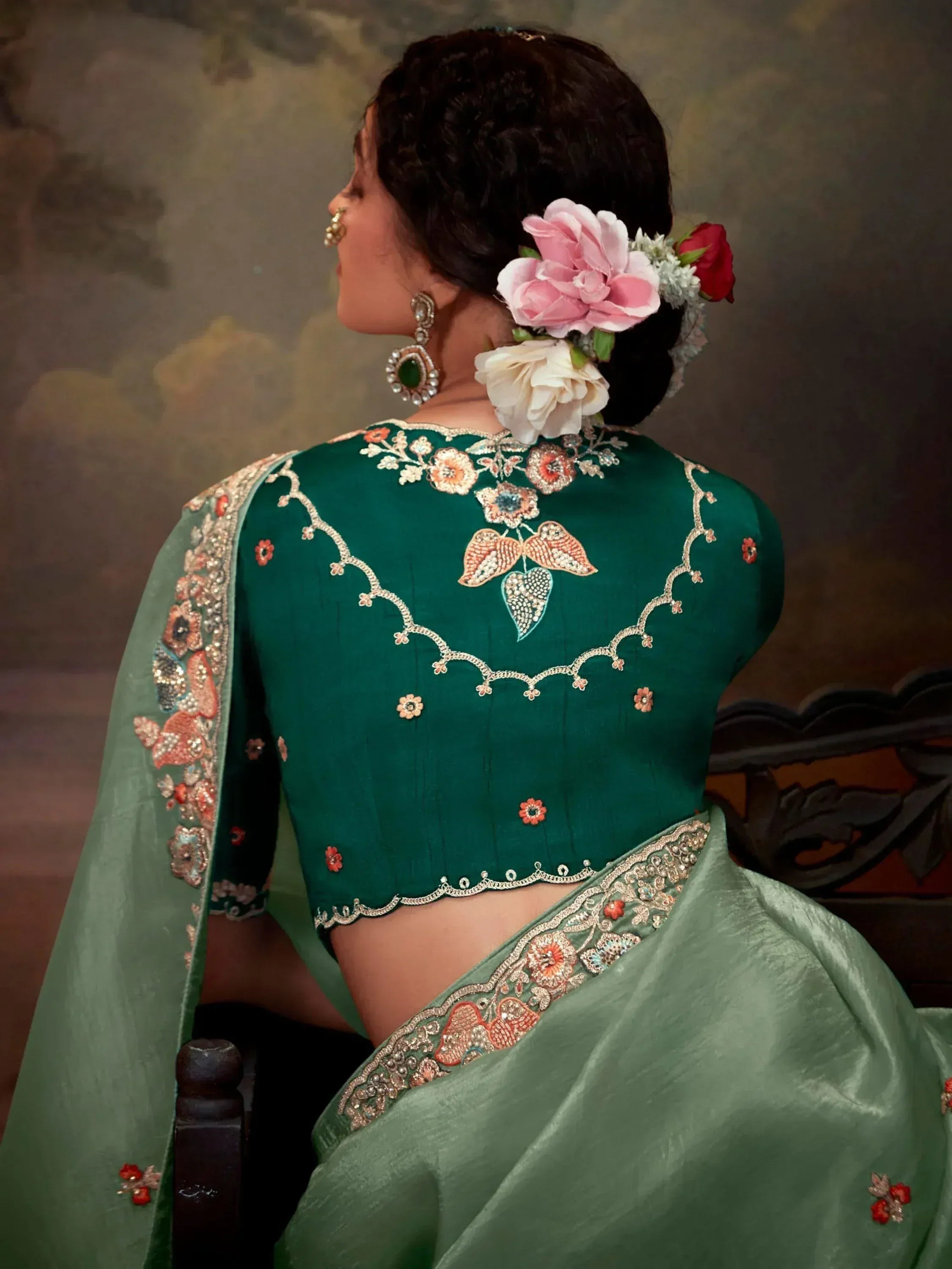Emerald green embroidered saree blouse with floral back design, perfect for Indian ethnic wear