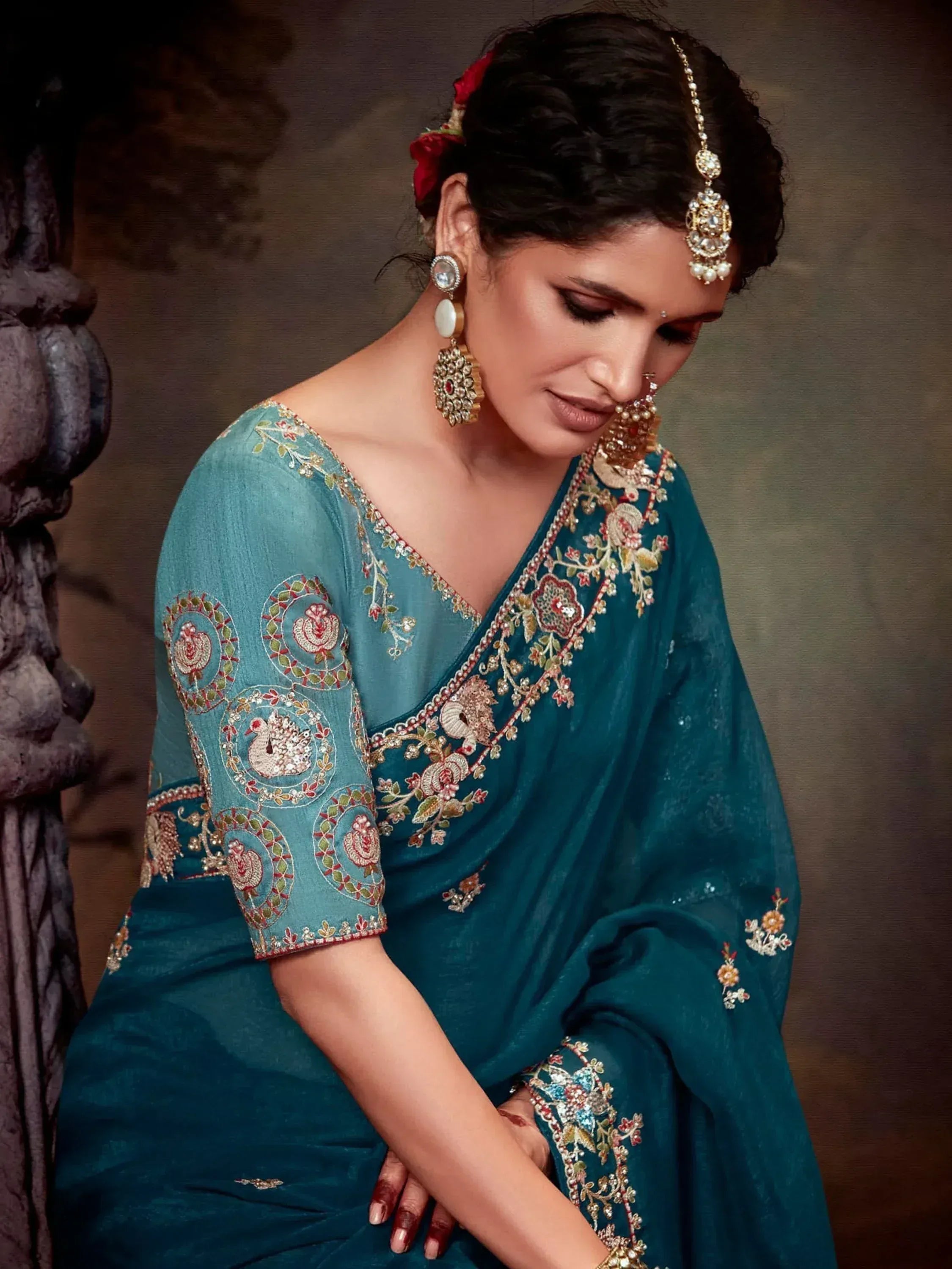 Teal embroidered saree with peacock motifs, traditional Indian ethnic wear for women