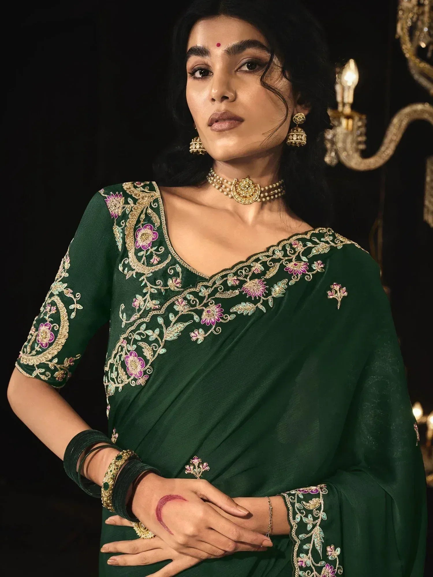 Emerald green embroidered saree with floral motifs, perfect for Indian ethnic occasions and festive wear.