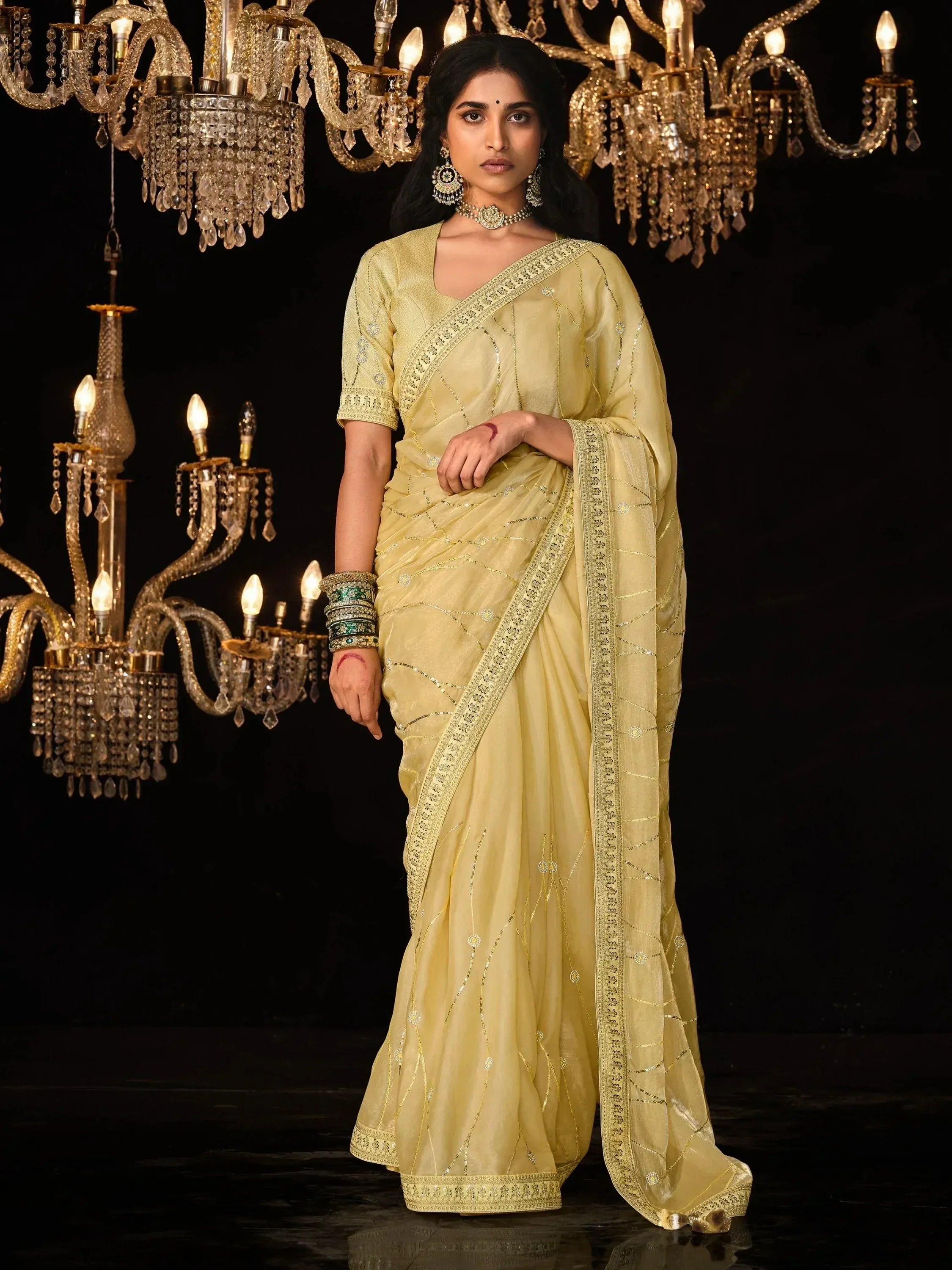 Elegant yellow saree with gold embroidery, perfect for Indian ethnic wear and festive occasions.
