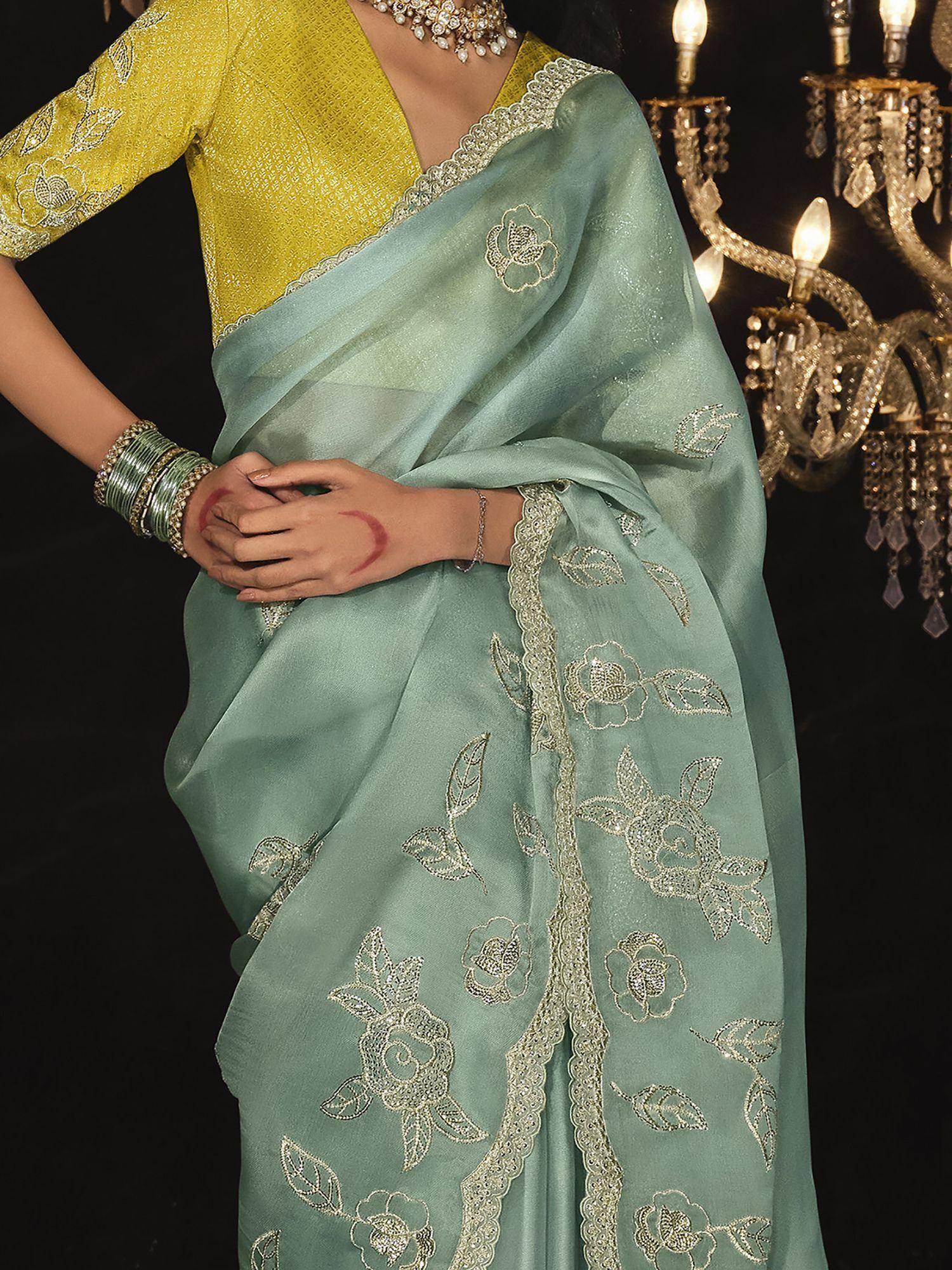 Mint green embroidered saree with yellow blouse, floral zari work, perfect for Indian ethnic occasions