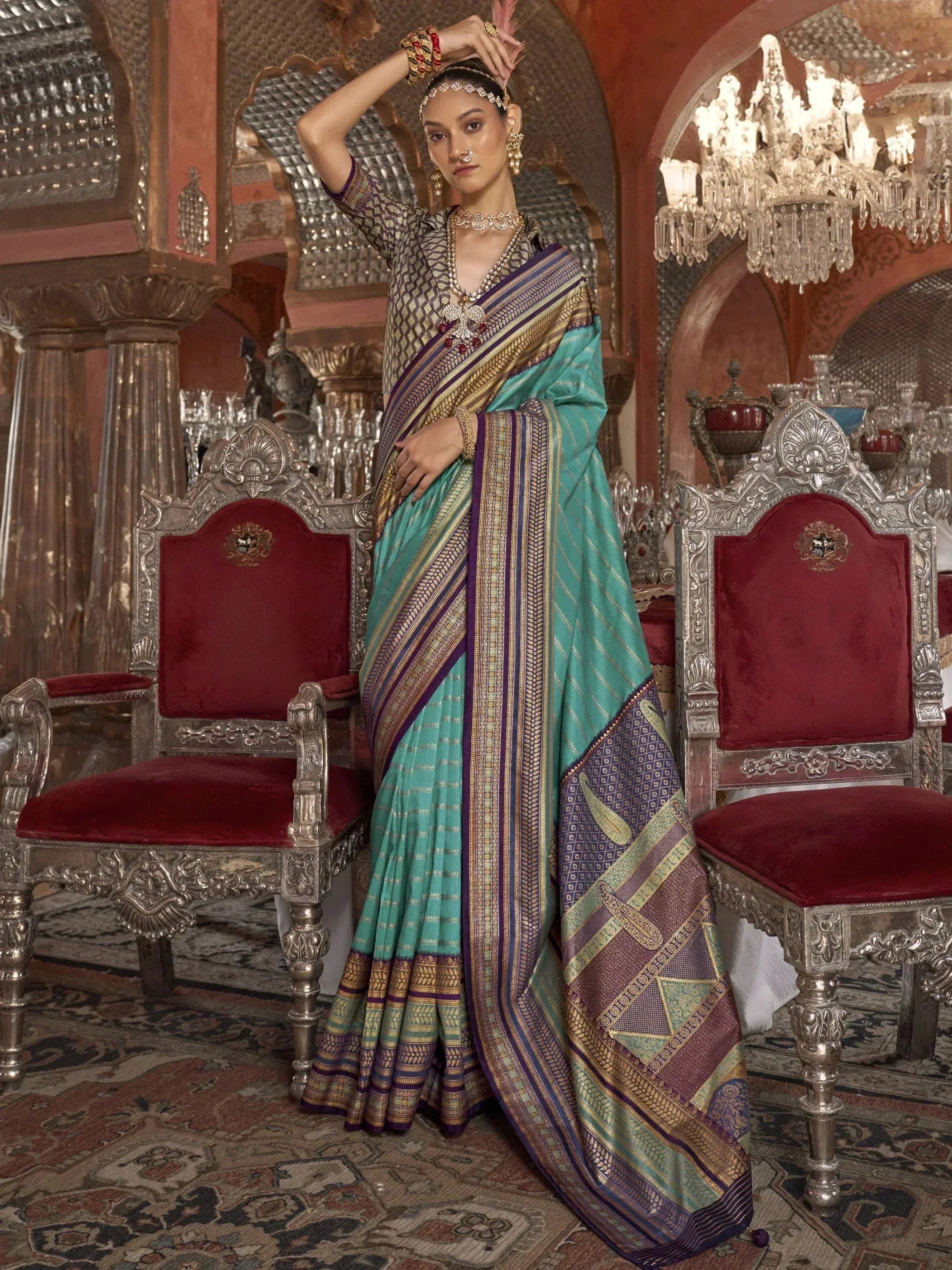 Elegant teal and purple designer saree with gold zari work, perfect for Indian ethnic occasions