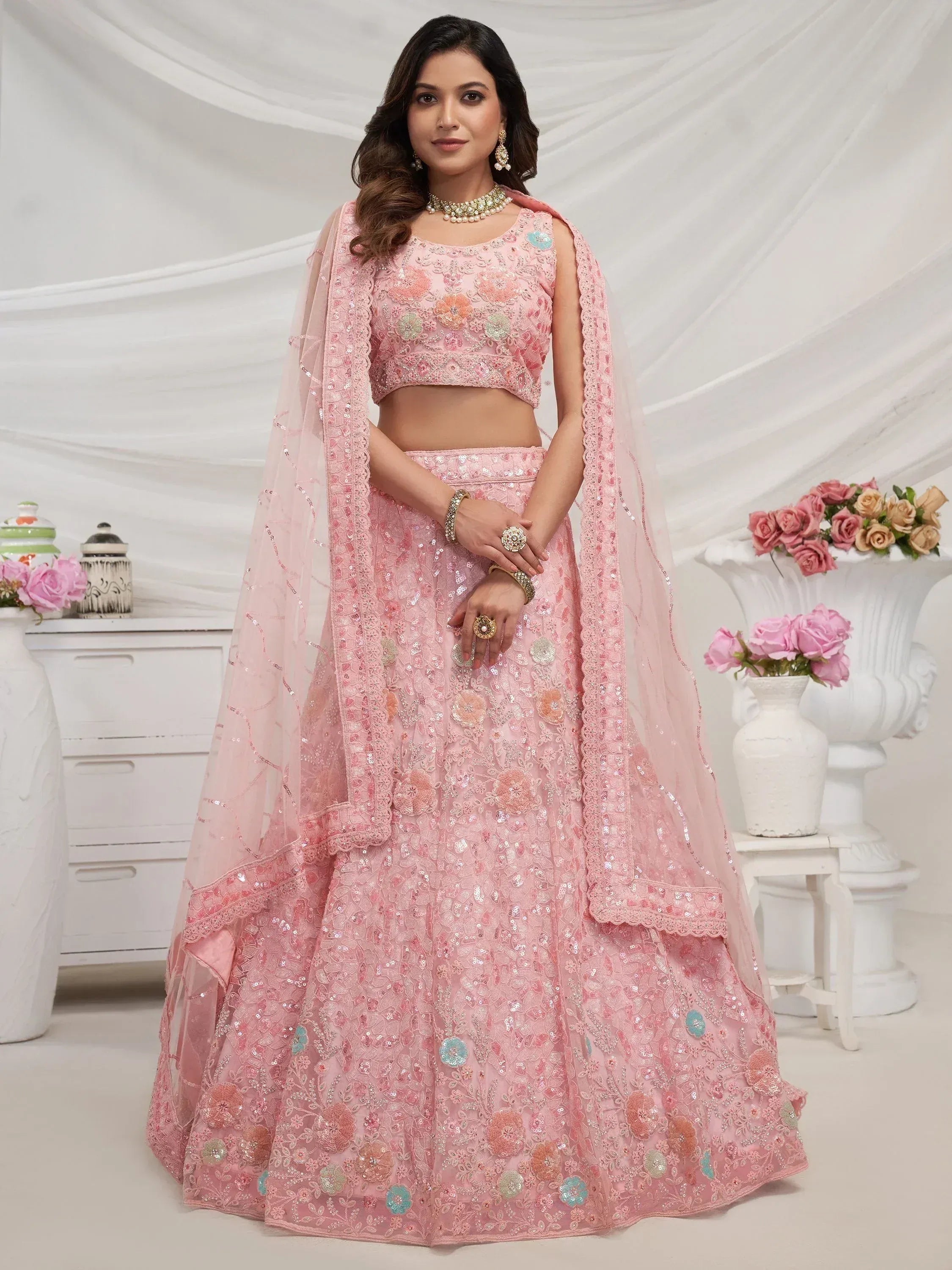 Pink floral embroidered lehenga choli with sequins, perfect for Indian weddings and festive occasions.