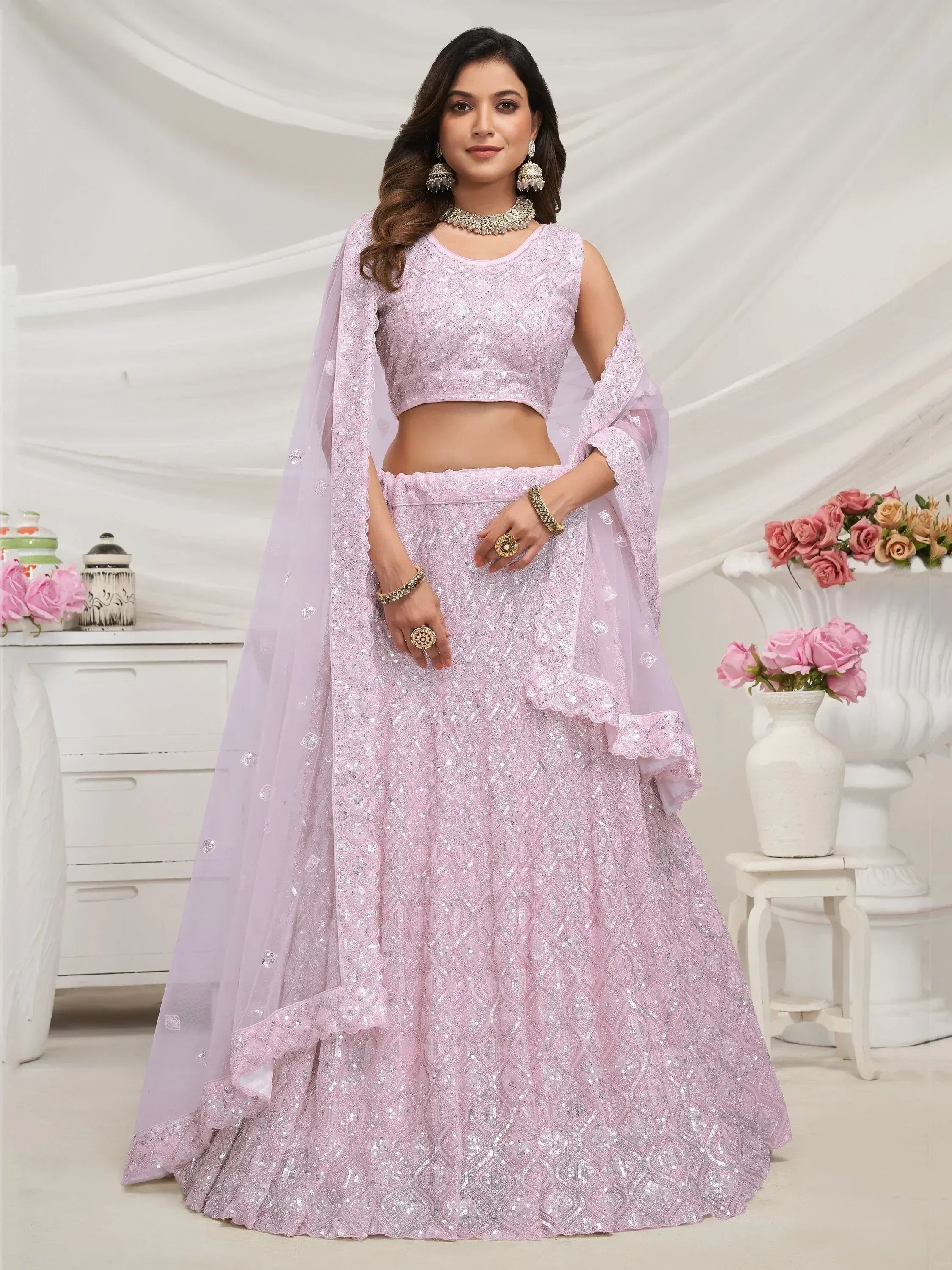 Elegant lavender lehenga choli with sequin embroidery, perfect for Indian weddings and festive occasions.