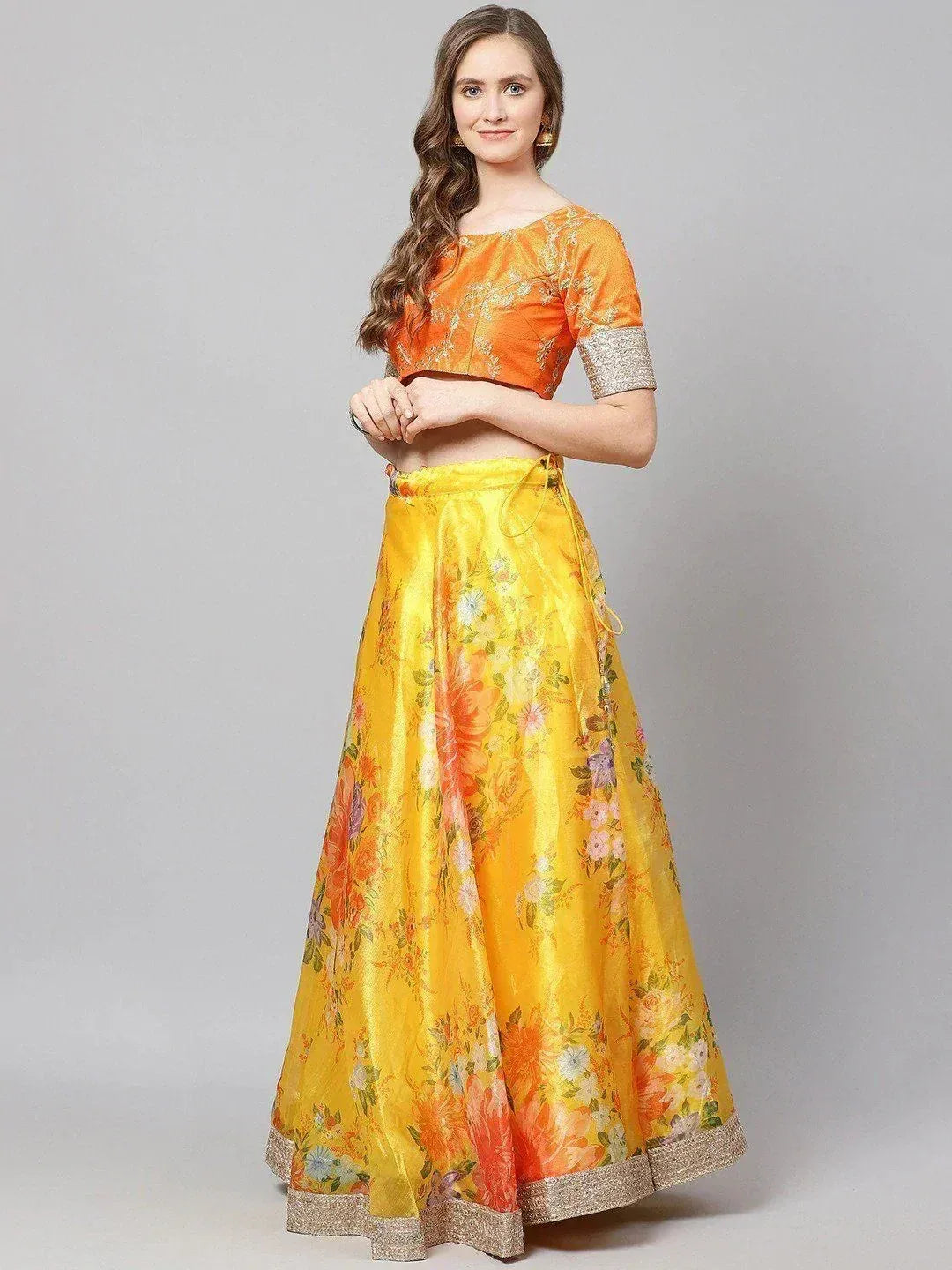 Vibrant yellow floral lehenga with orange embroidered crop top, perfect for Indian ethnic occasions