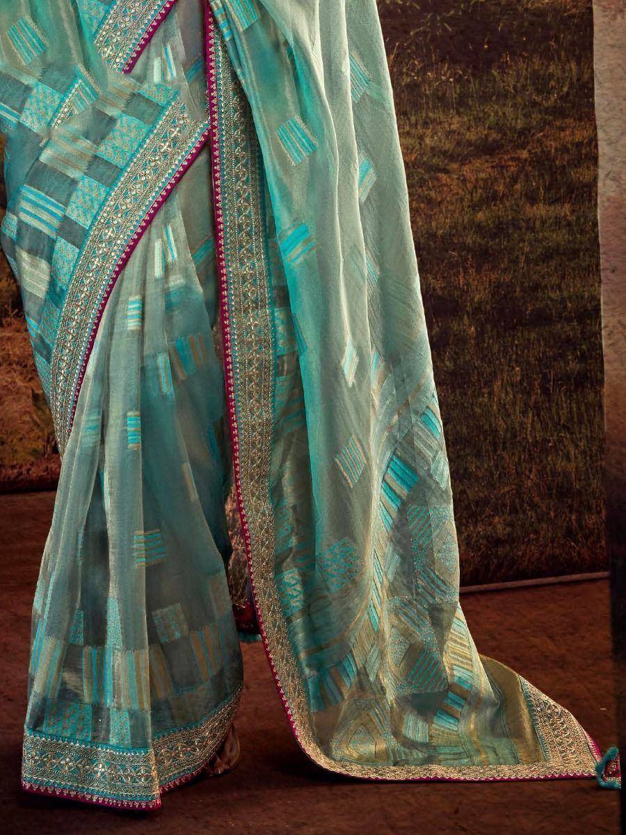 Teal designer saree with geometric print and embroidered border, ethnic wear for women