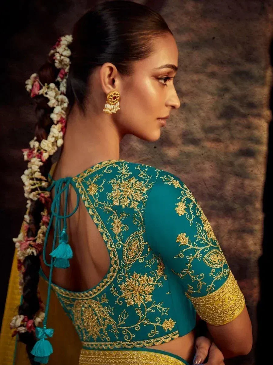 Teal embroidered blouse with gold floral work, back tie detail, and floral braid for ethnic wear
