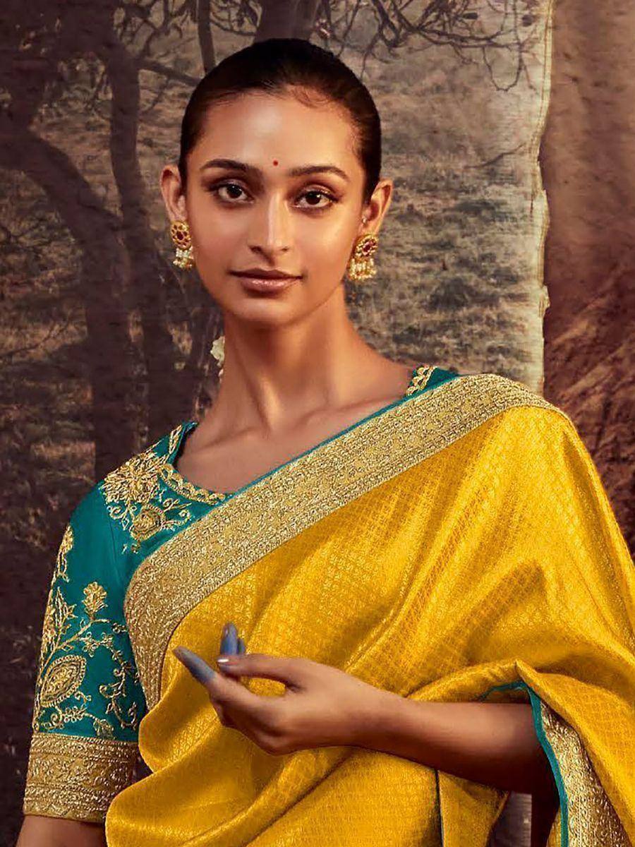 Yellow and teal designer saree with gold embroidery, perfect for Indian ethnic wear occasions