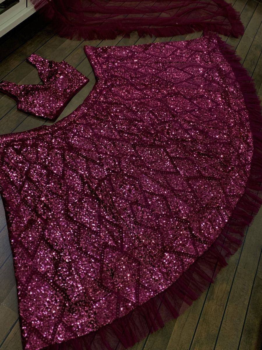 Sparkling maroon lehenga choli with sequin work and tulle fringe, perfect for Indian ethnic wear events