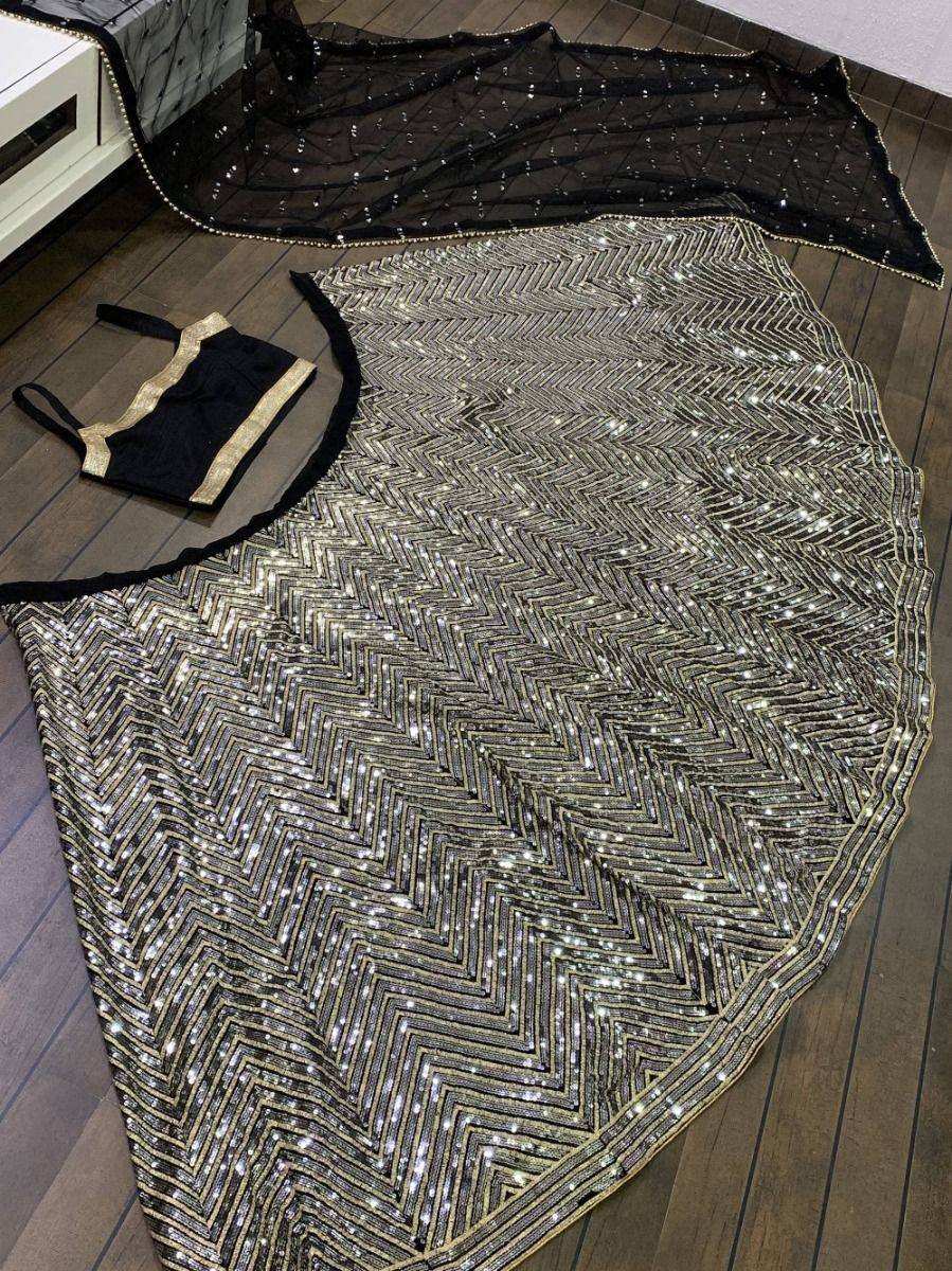 Black and gold sequin lehenga choli with chevron pattern and sheer dupatta, ethnic Indian wear