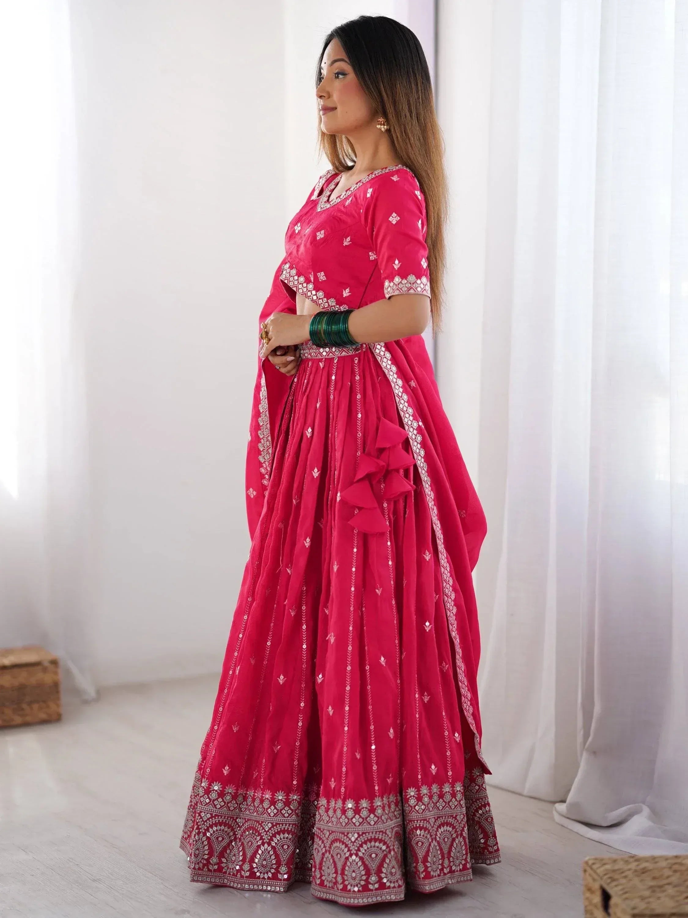 Pink embroidered lehenga choli with ruffle detailing, perfect for Indian ethnic wear occasions