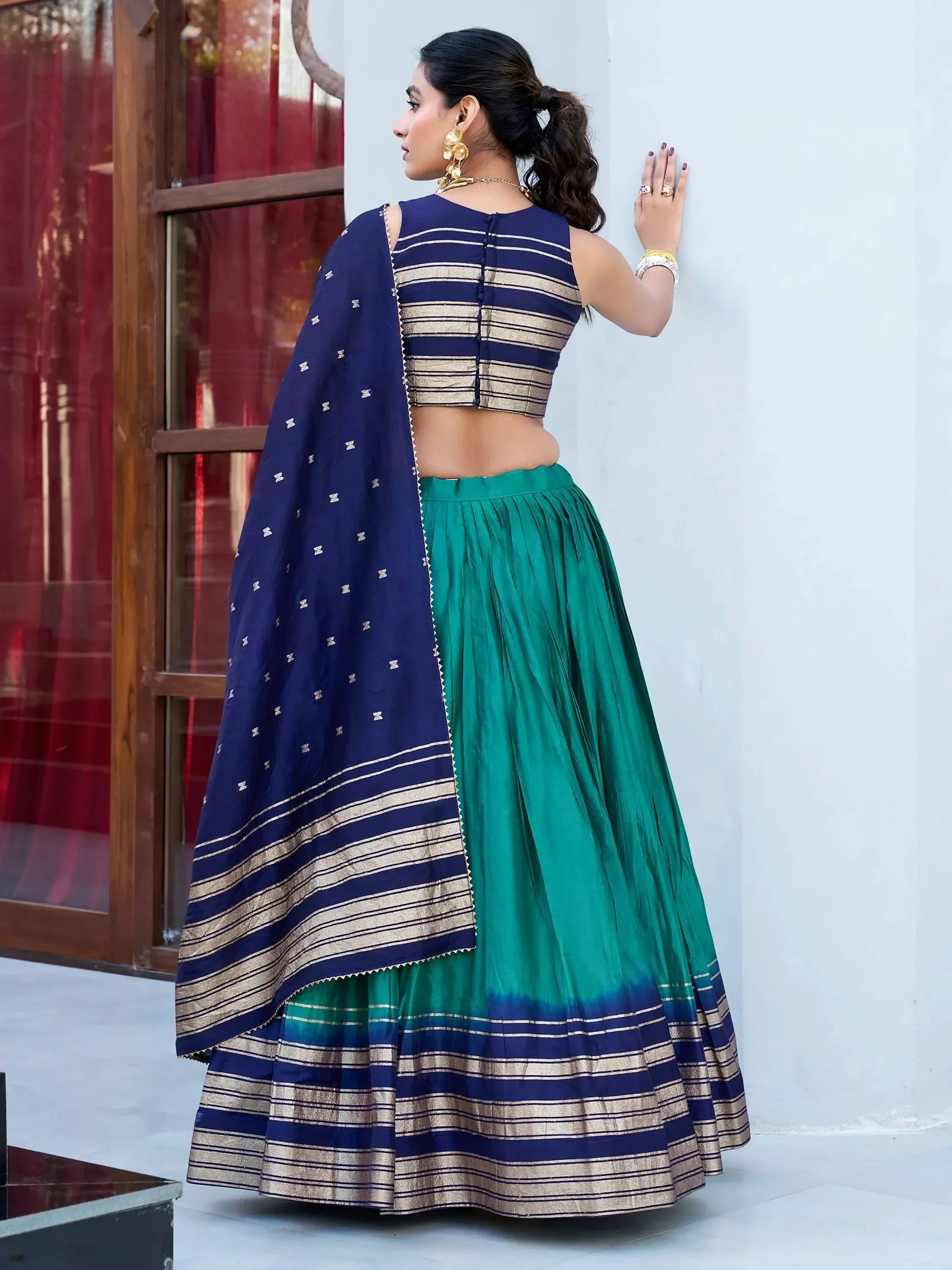 Navy and green lehenga choli with gold stripes, perfect for Indian ethnic wear events