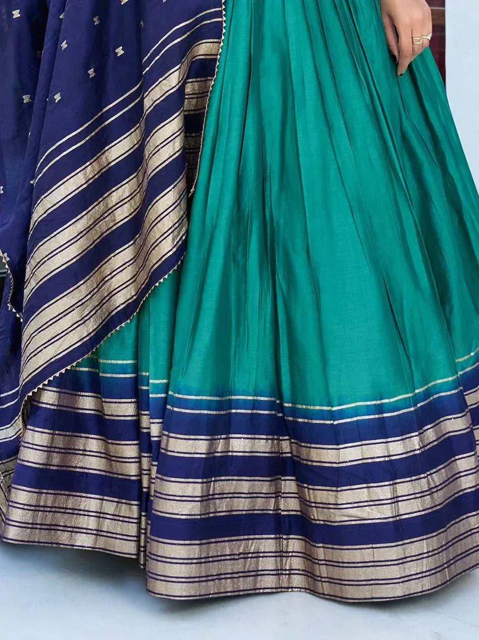 Teal and navy blue lehenga with gold striped border, ethnic Indian wear