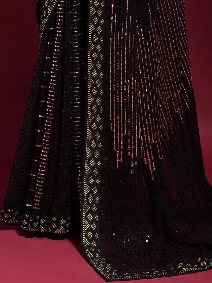 Black ethnic saree with pink and gold sequin embroidery, perfect for festive occasions
