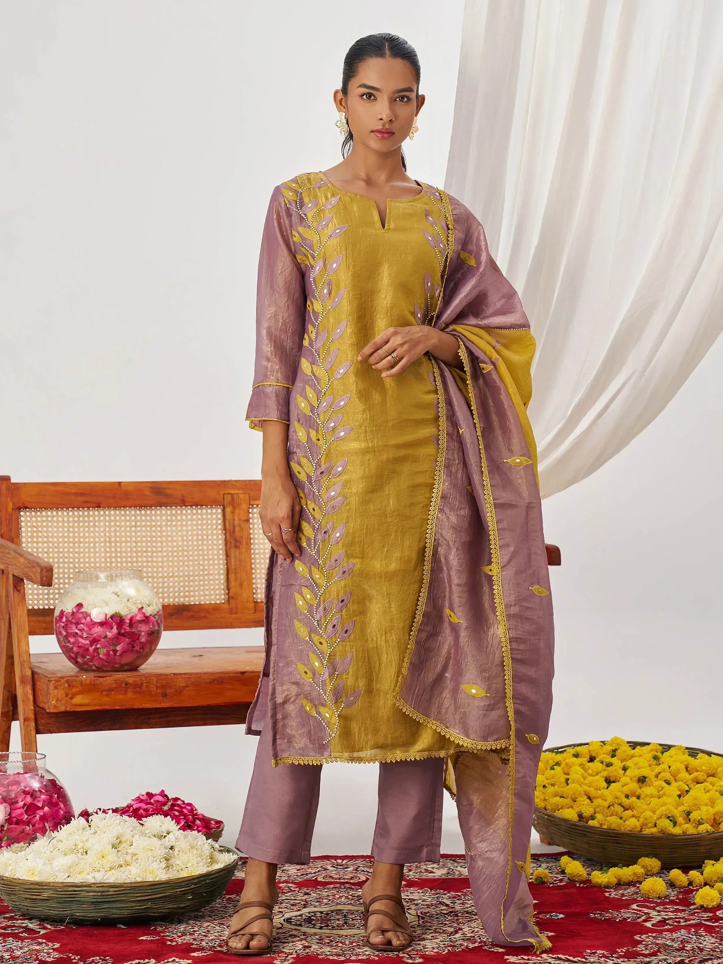 Yellow and mauve embroidered salwar kameez with leaf motif, perfect for Indian ethnic wear occasions.