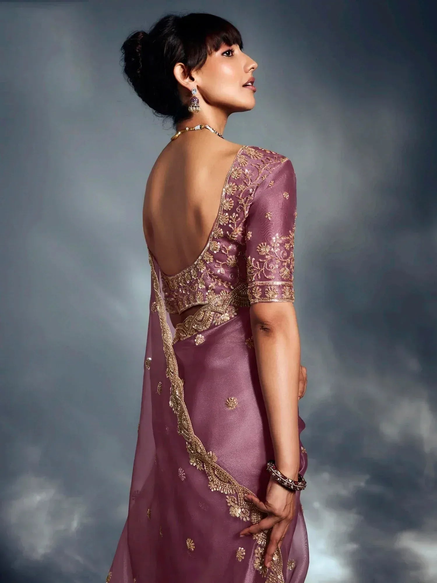 Elegant mauve saree with gold embroidery and backless blouse, perfect for Indian ethnic occasions