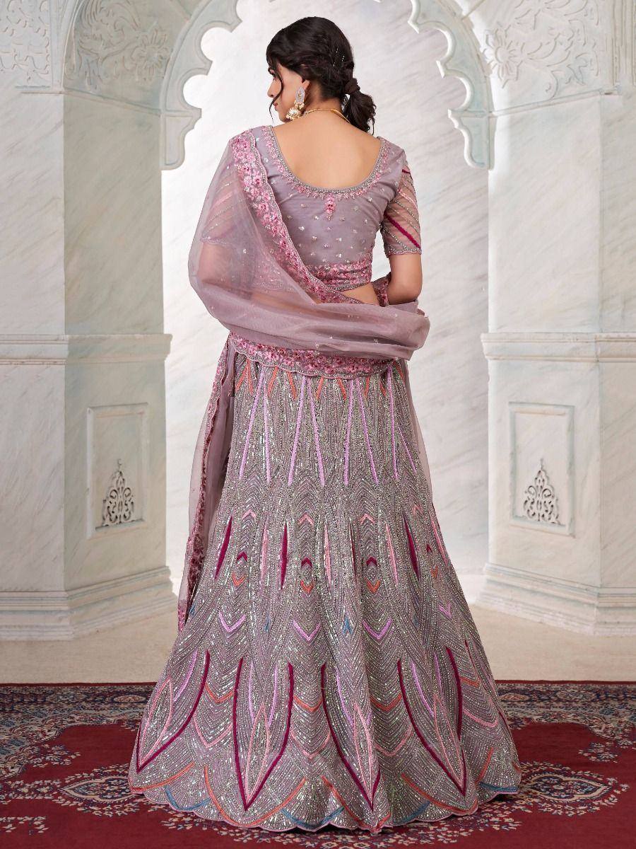 Elegant grey lehenga choli with pink embroidery, perfect for Indian weddings and festive occasions.
