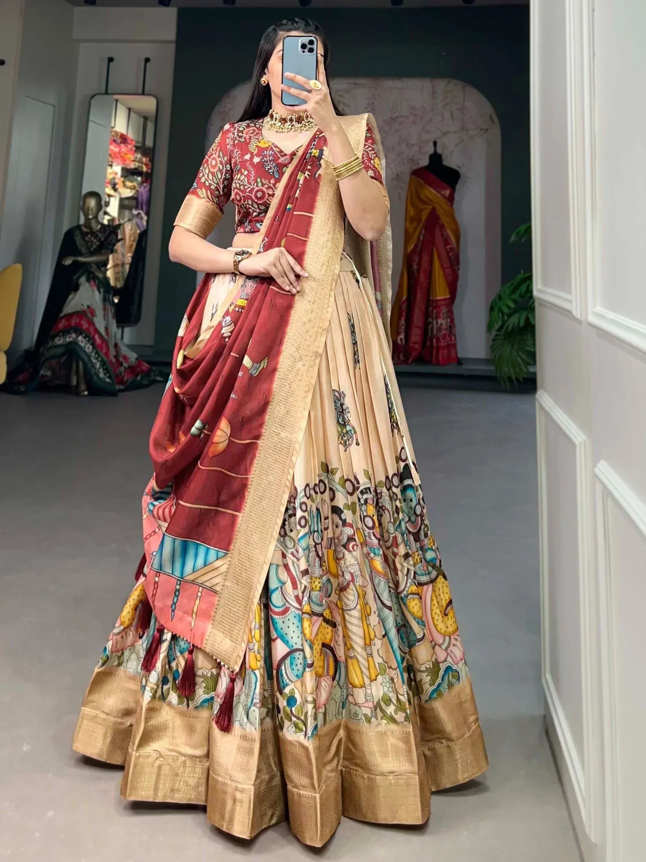 Woman in designer lehenga choli with floral and tribal print, gold border, perfect for Indian ethnic wear occasions