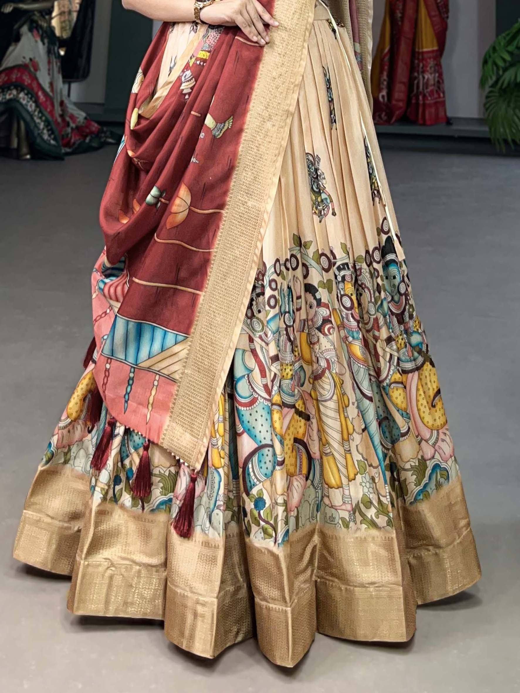 Beige lehenga with colorful temple art print, red dupatta, and gold border for ethnic wear