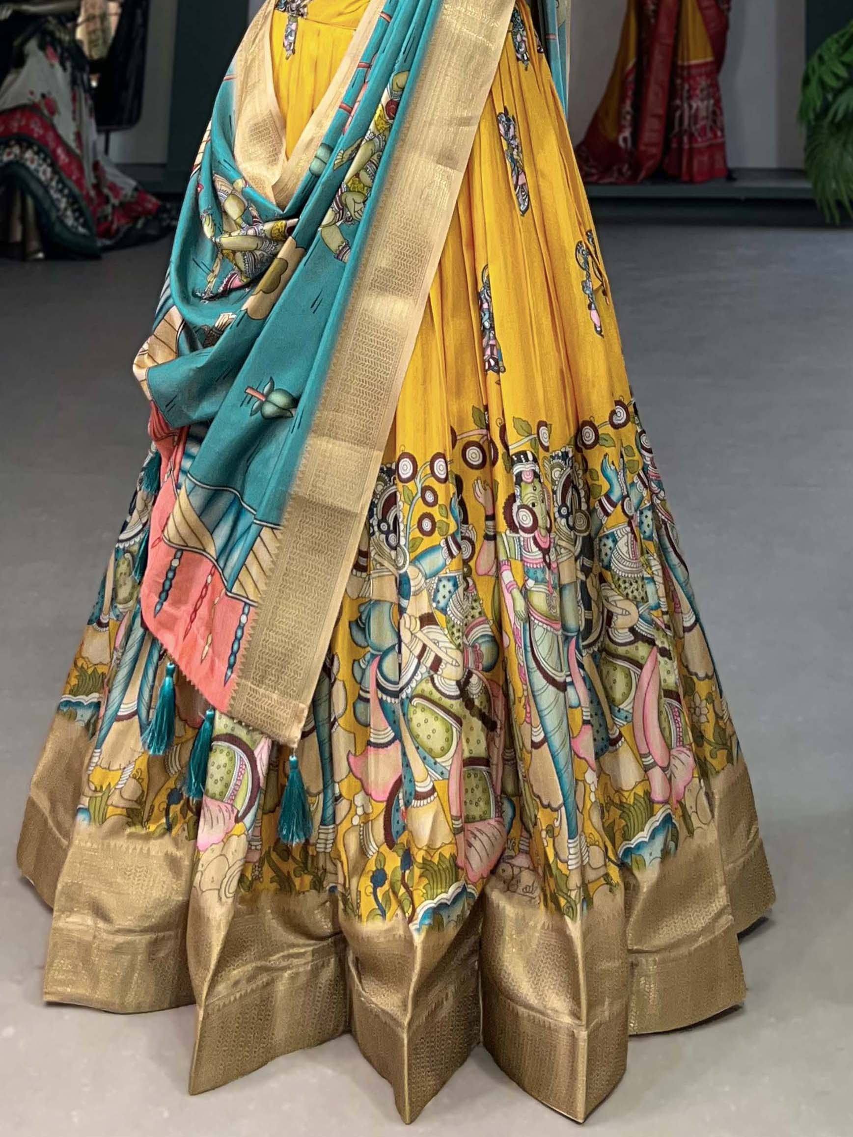 Yellow lehenga choli with Ganesha print, turquoise dupatta, and gold border for ethnic wear