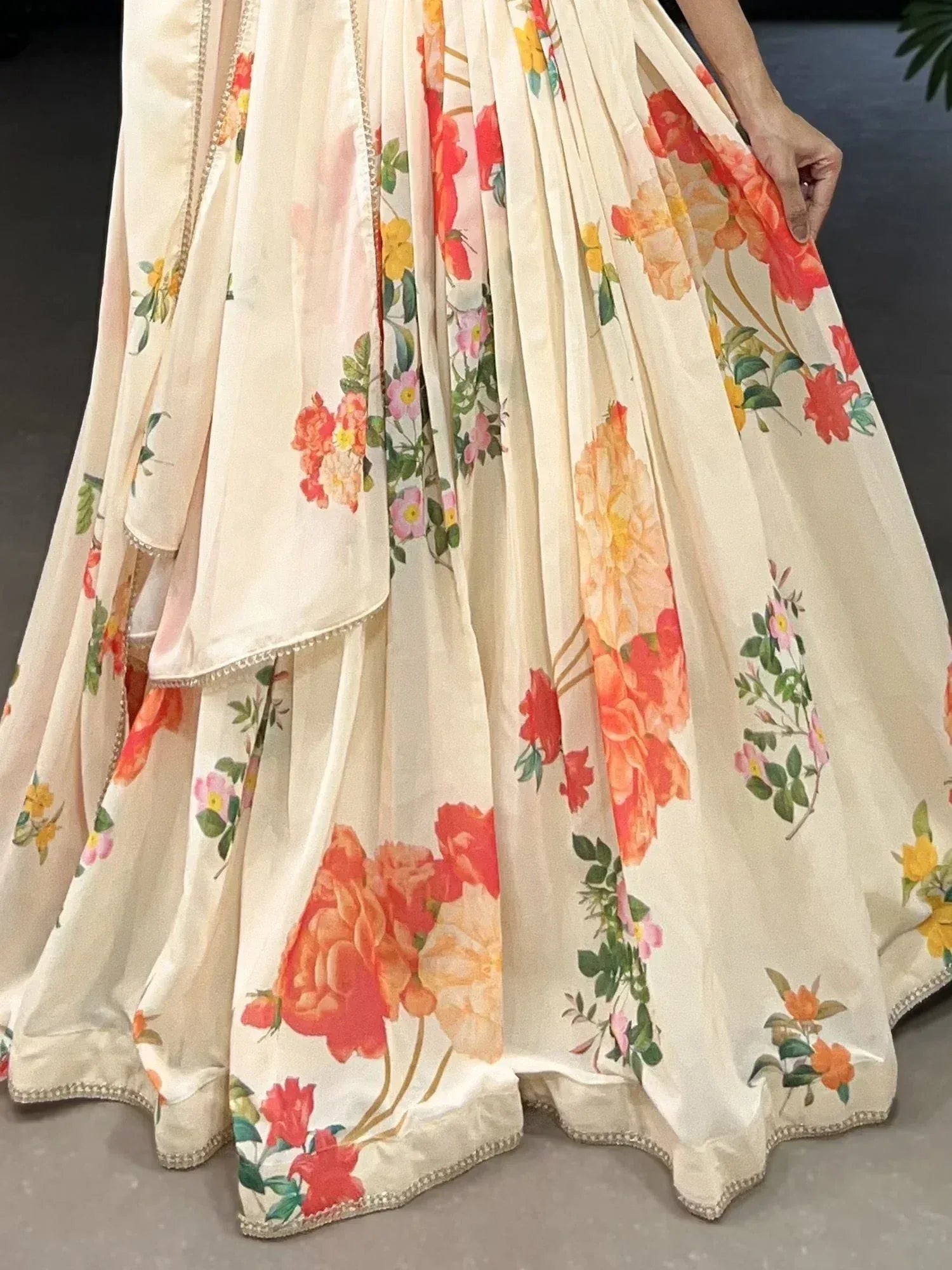 Cream floral lehenga with vibrant rose print and delicate embroidery, perfect for ethnic occasions