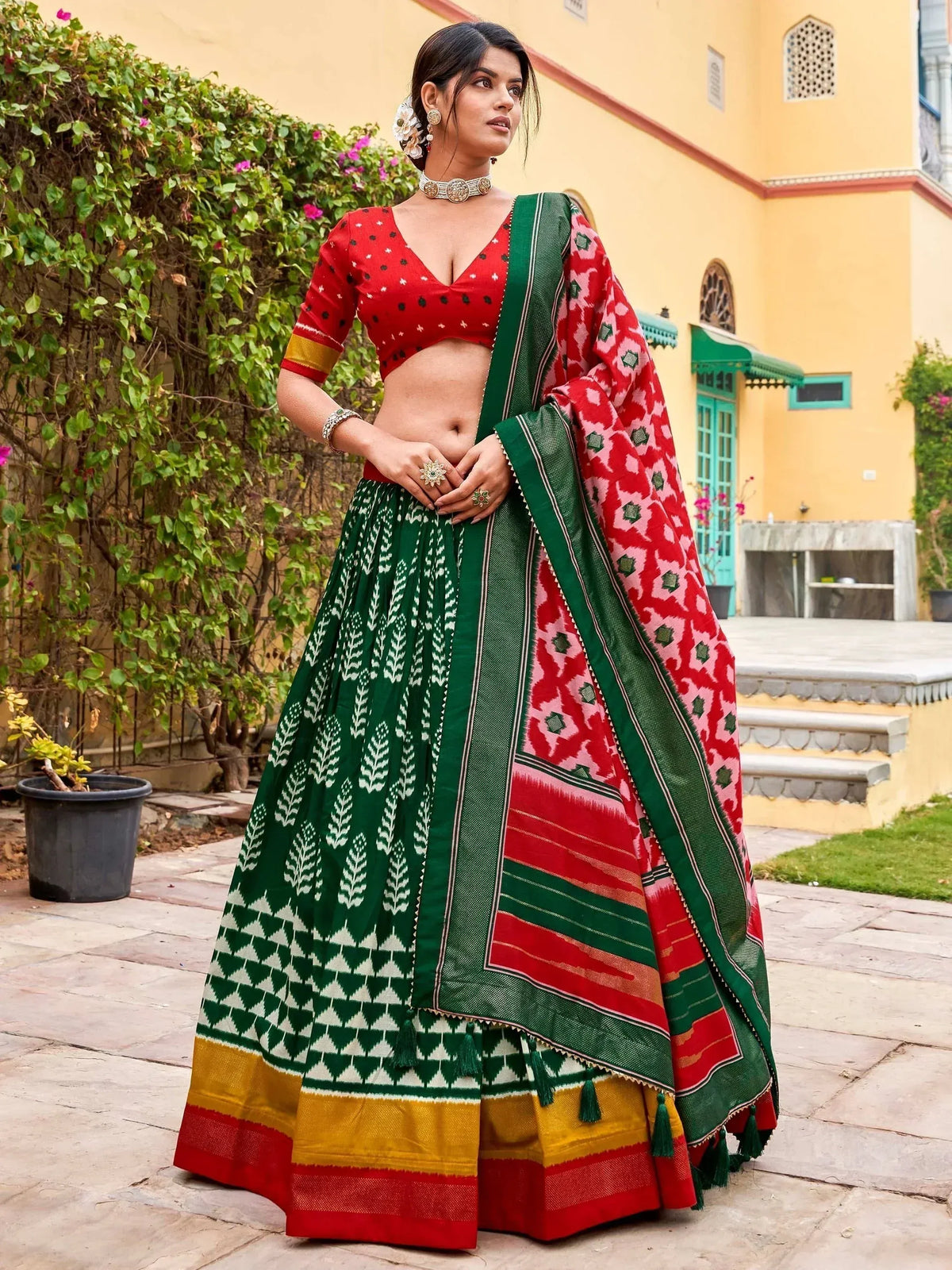 Red and green printed lehenga choli with ikat dupatta, ethnic Indian wear for women