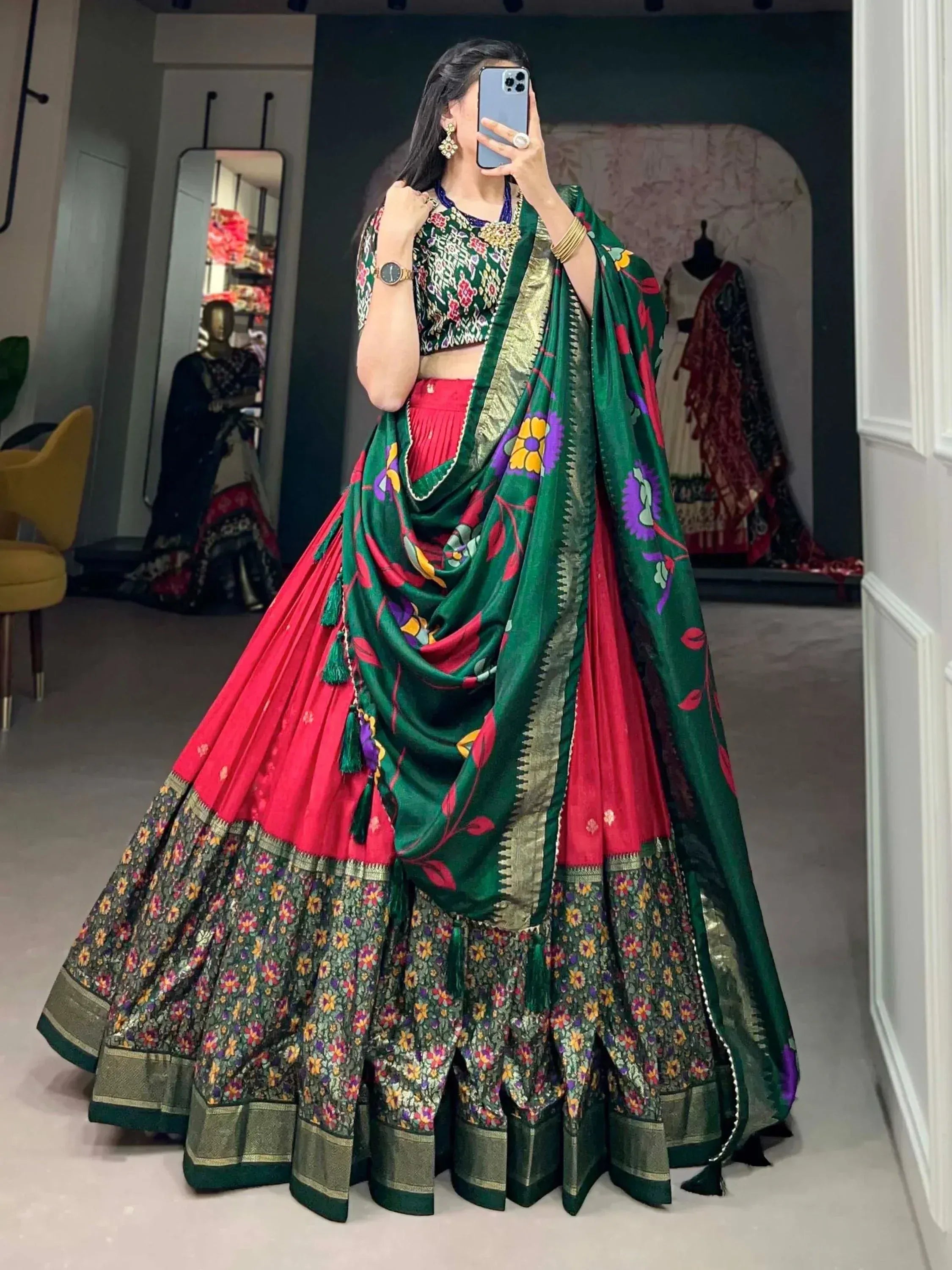 Green and red floral lehenga choli with embroidered dupatta, perfect for Indian ethnic wear occasions.