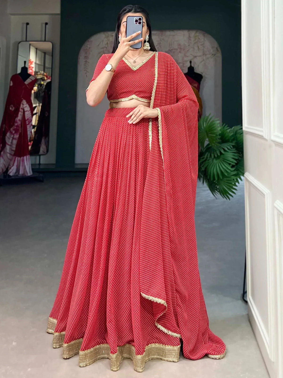 Red printed lehenga choli with gold trim, Indian ethnic wear for women