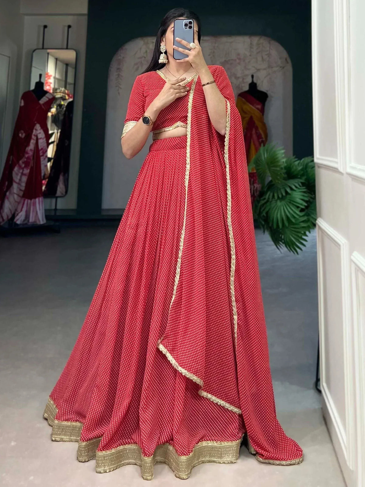 Red printed lehenga choli with gold border, ethnic wear for women