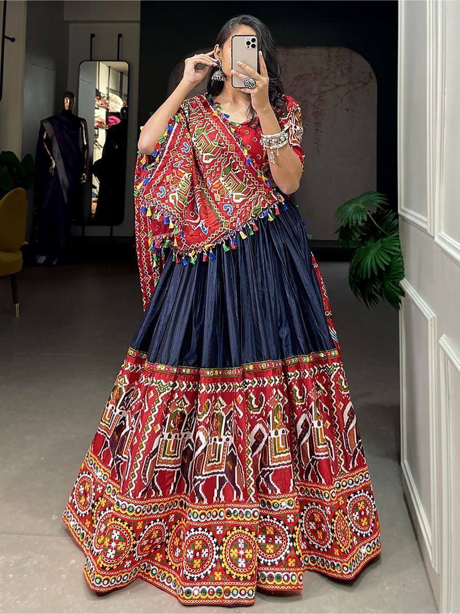 Red and navy blue embroidered lehenga choli with mirror work and tassels, perfect for Indian ethnic occasions